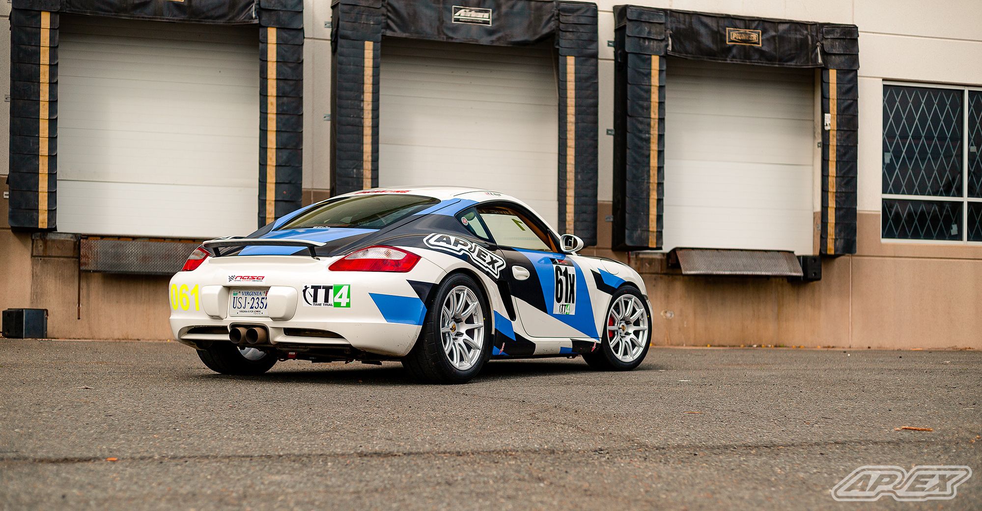 White Porsche 987 Cayman S with 18" SM-10 Apex wheels in Race Silver
