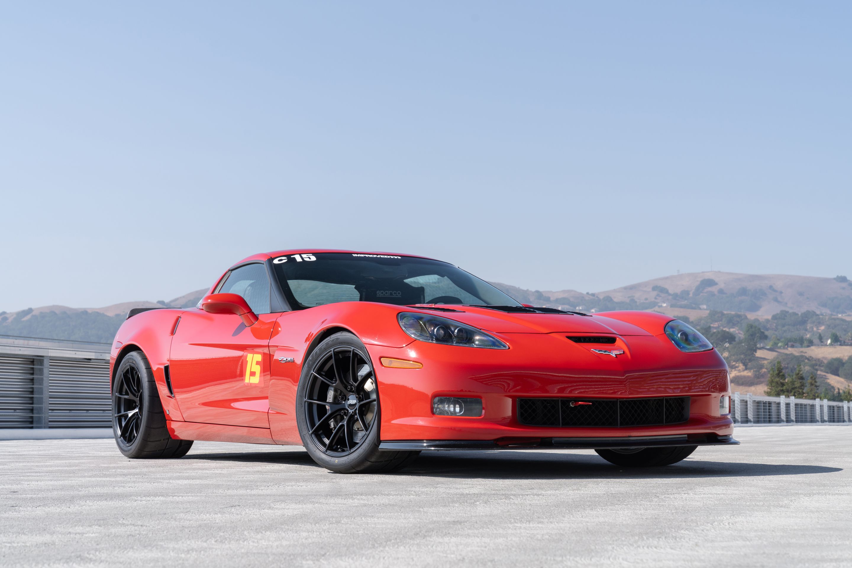 Red Chevrolet C6 Corvette Z06 with 18" VS-5RS Apex wheels in Satin Black