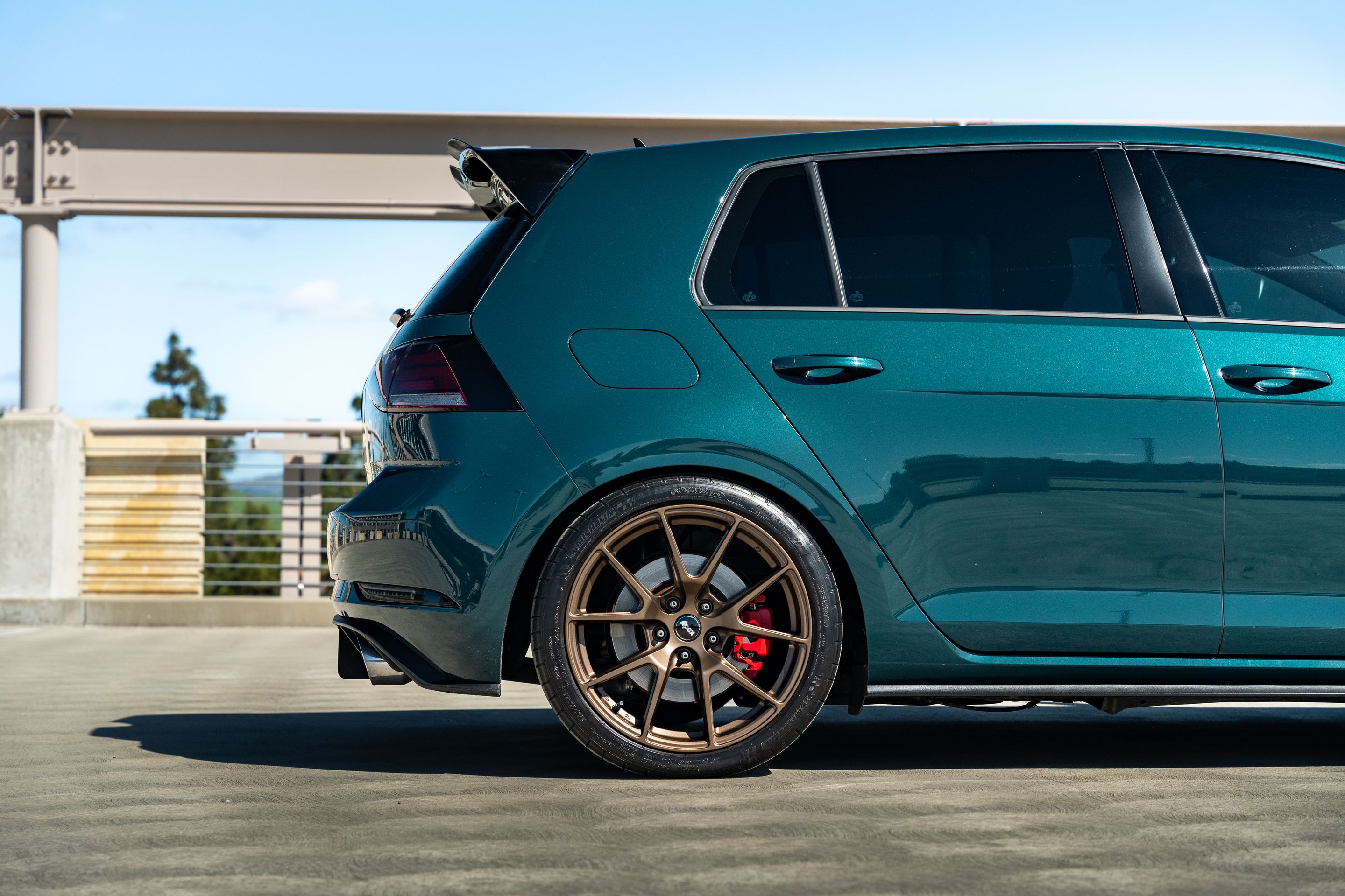 Green VW MK7 GTI with 18" VS-5 Apex wheels in Satin Bronze
