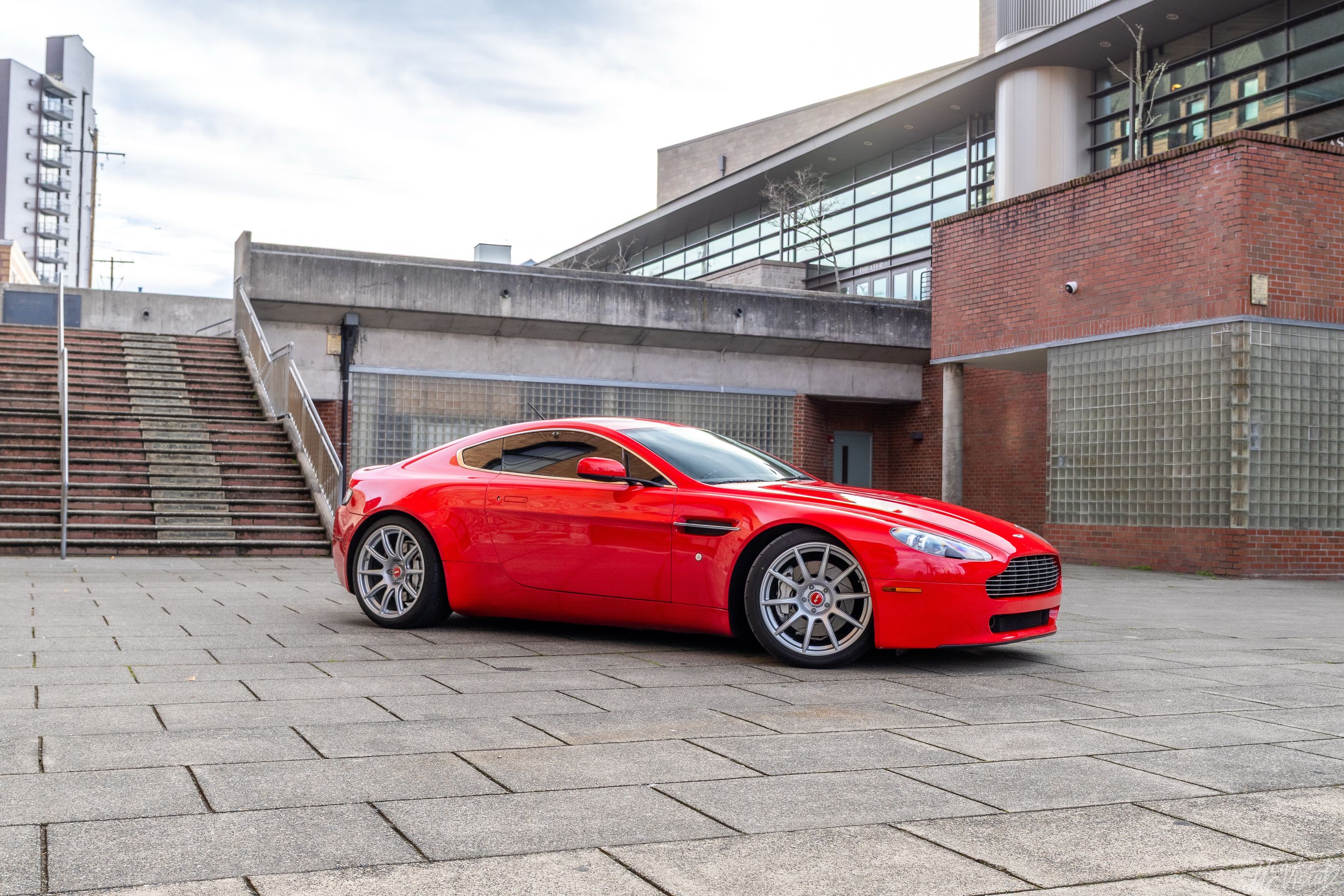 Red Aston Martin V8/V12 Vantage with 19" SM-10 Apex wheels in Race Silver