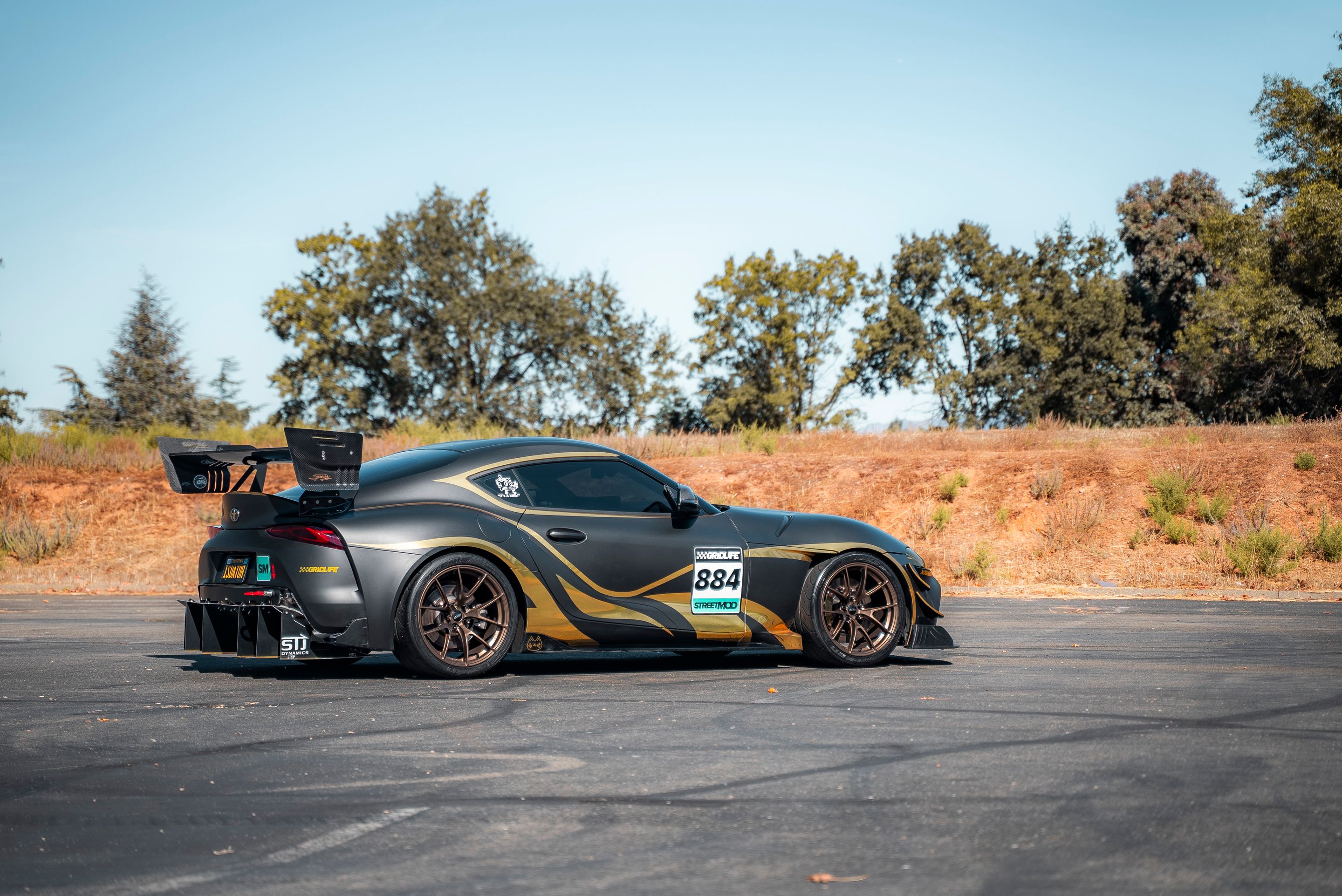 Grey Toyota GR Supra with 19" VS-5RS Apex wheels in Satin Bronze