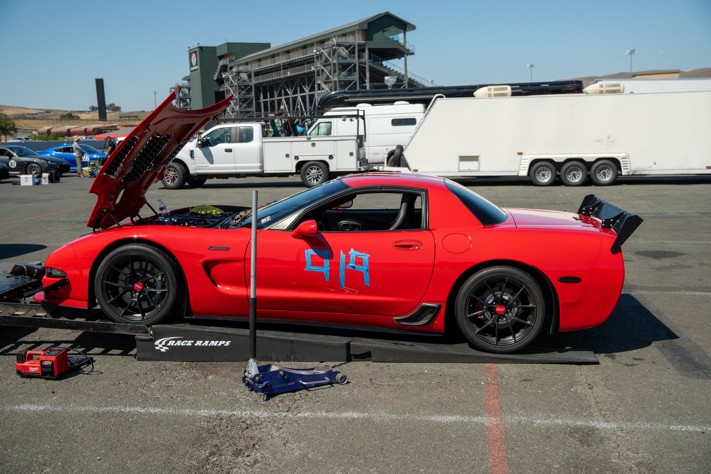 Red Chevrolet C5 Corvette Z06 with 18" VS-5RS Apex wheels in Satin Black