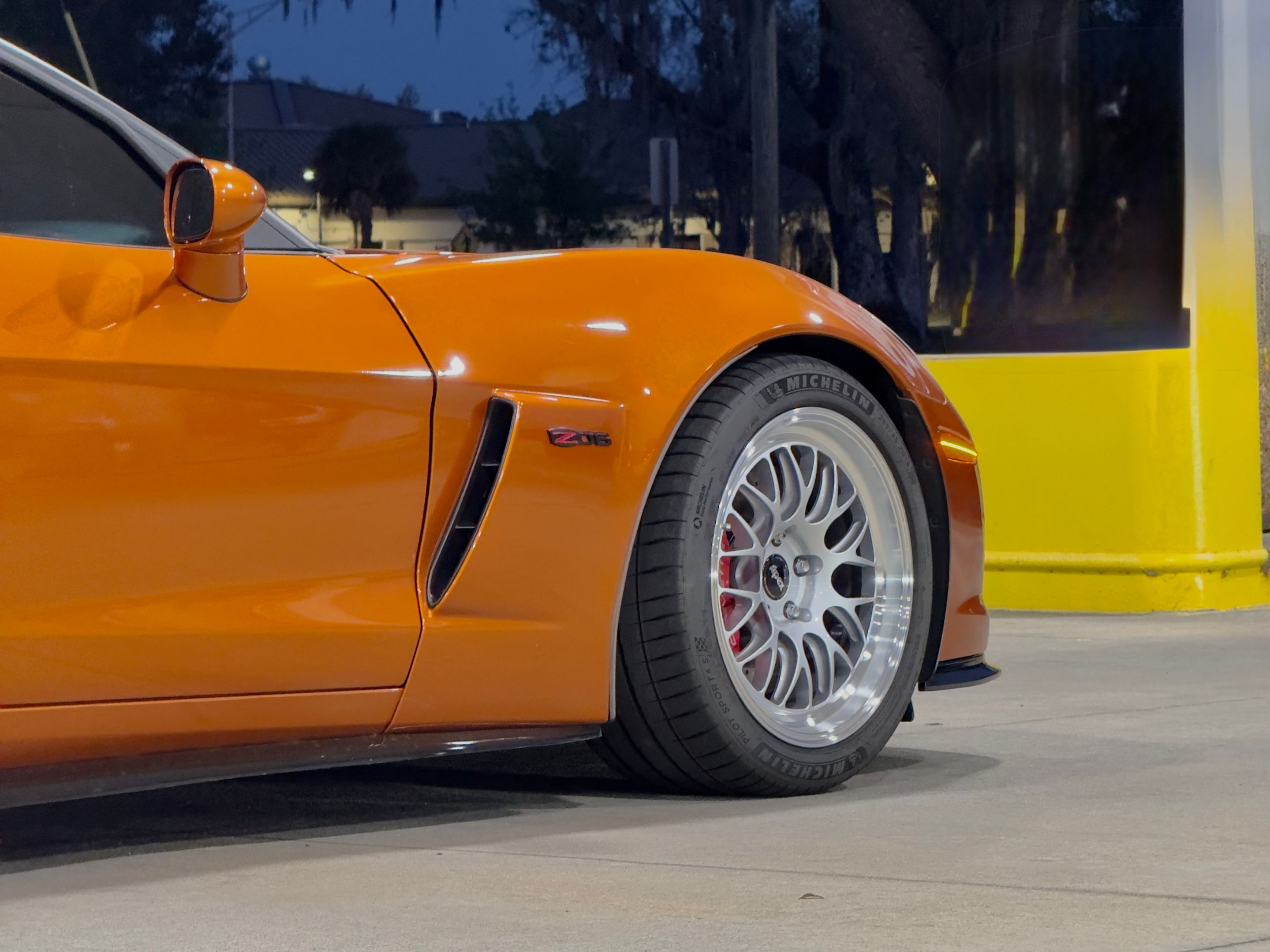 Orange Chevrolet C6 Corvette Z06 with 18"/19" ML-10RT Apex wheels in Machined Lip Race Silver