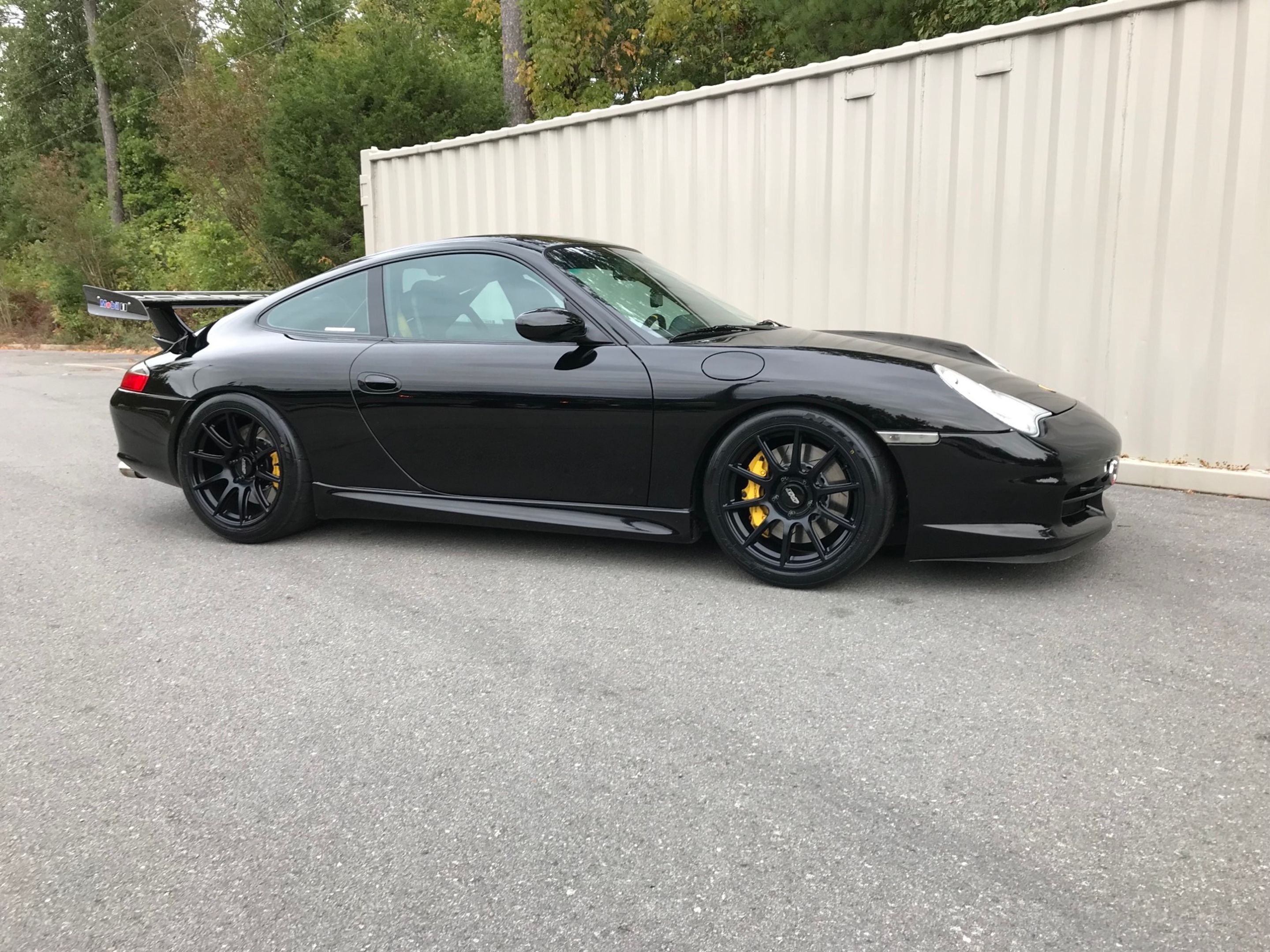Black Porsche 911 996 GT3 with 18" SM-10 Apex wheels in Satin Black