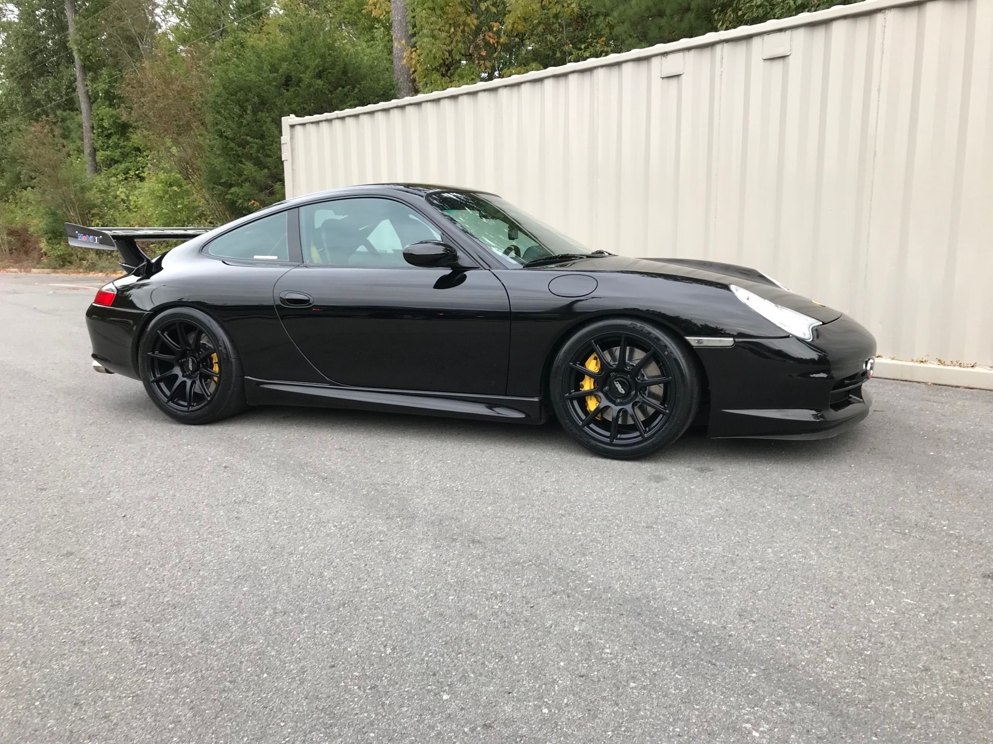 Black Porsche 911 996 GT3 with 18" SM-10 Apex wheels in Satin Black