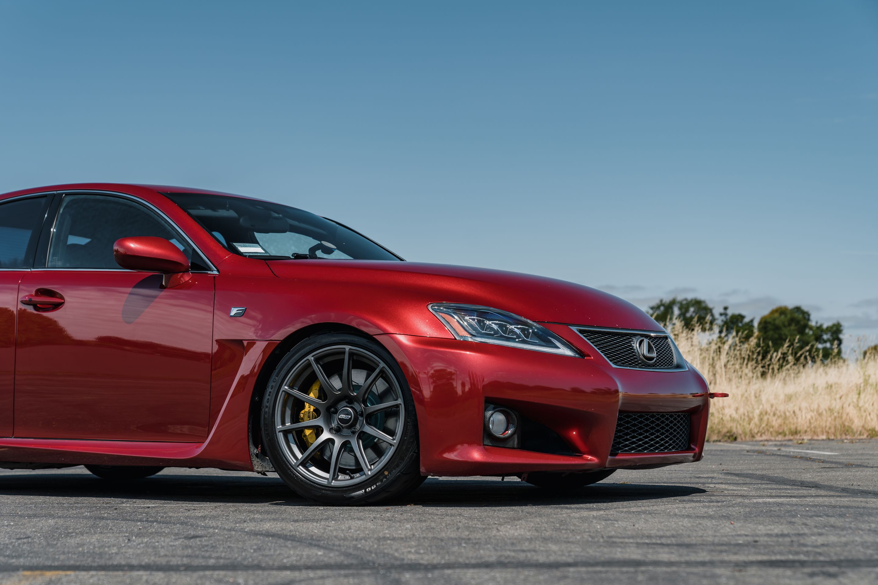 Red Lexus USE20 IS-F with 18" SM-10 Apex wheels in Anthracite