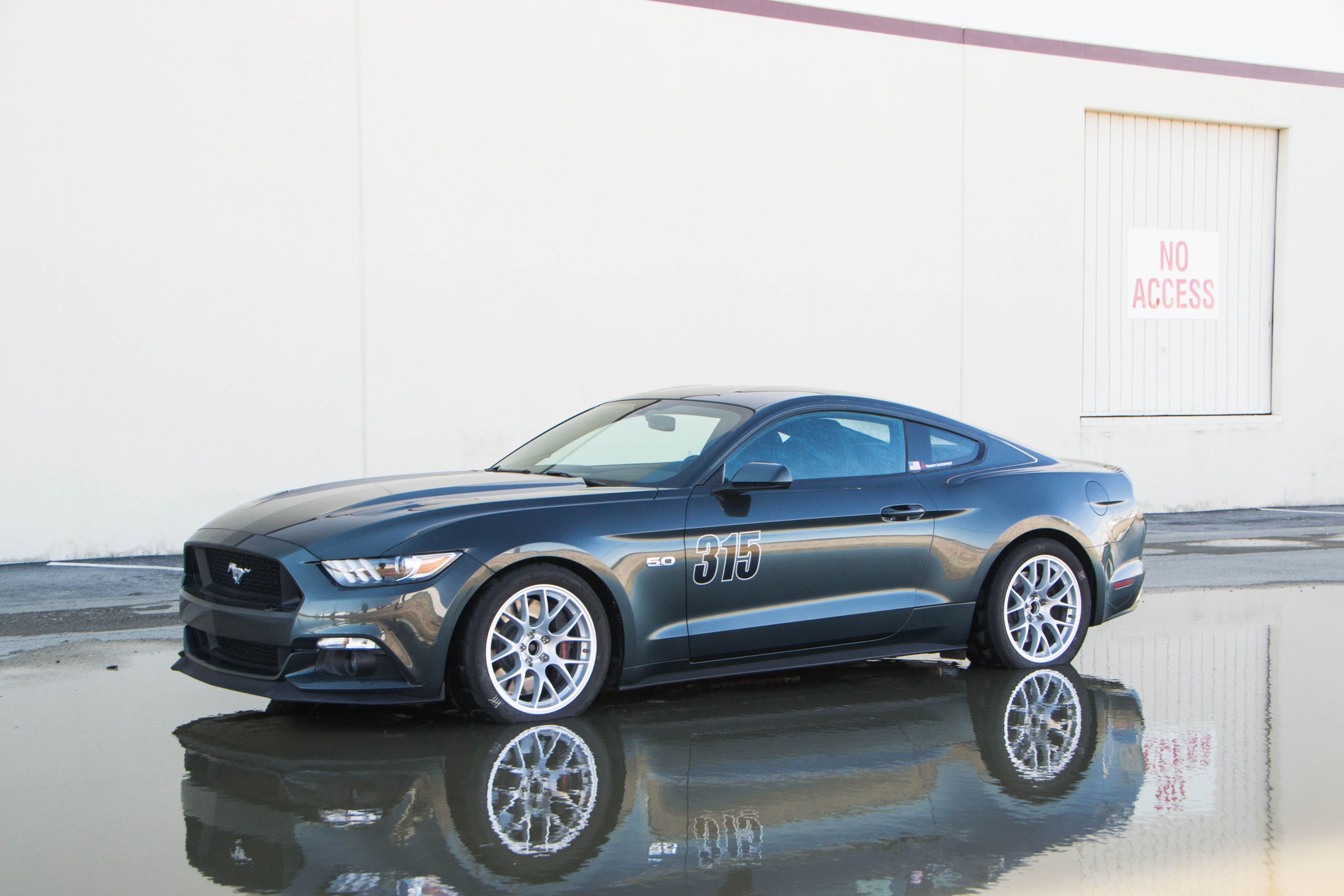 Green Ford S550 Mustang GT with 18" EC-7 Apex wheels in Race Silver