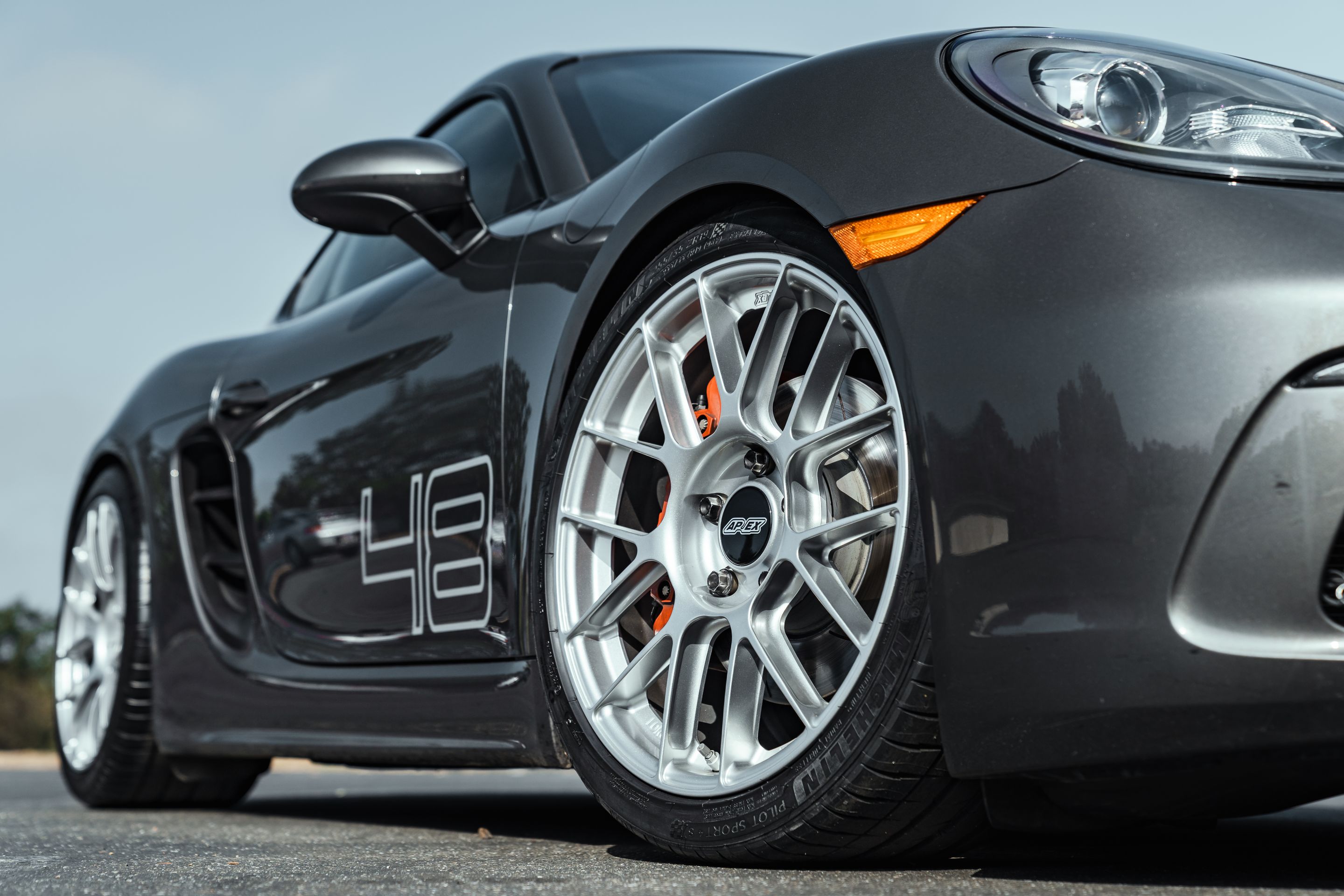 Grey Porsche 718 Cayman S with 19" EC-7RS Apex wheels in Race Silver