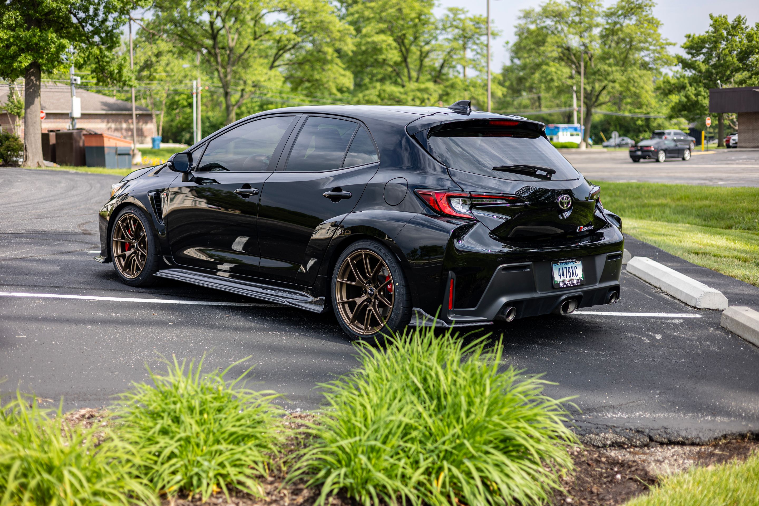 Black Toyota GR Corolla with 18" VS-5RS Apex wheels in Satin Bronze