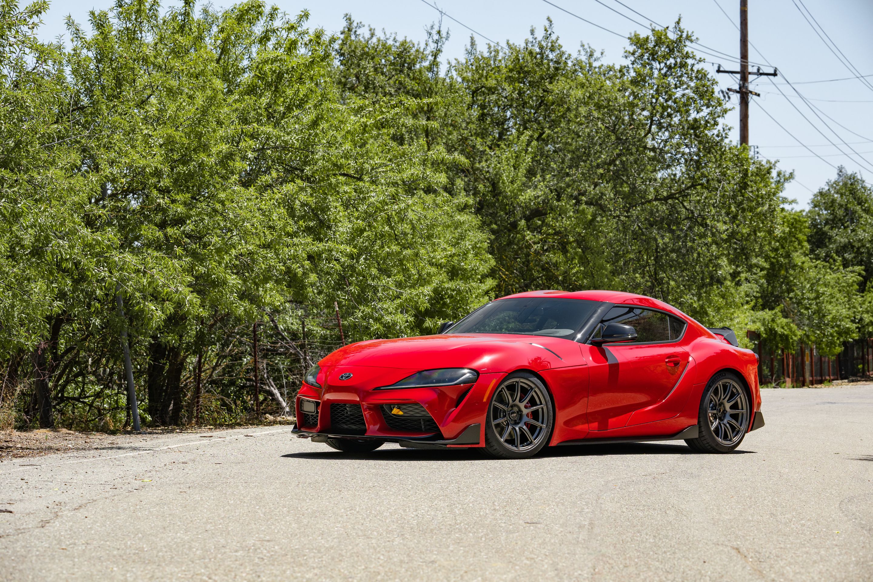 Red Toyota GR Supra with 19" SM-10 Apex wheels in Anthracite