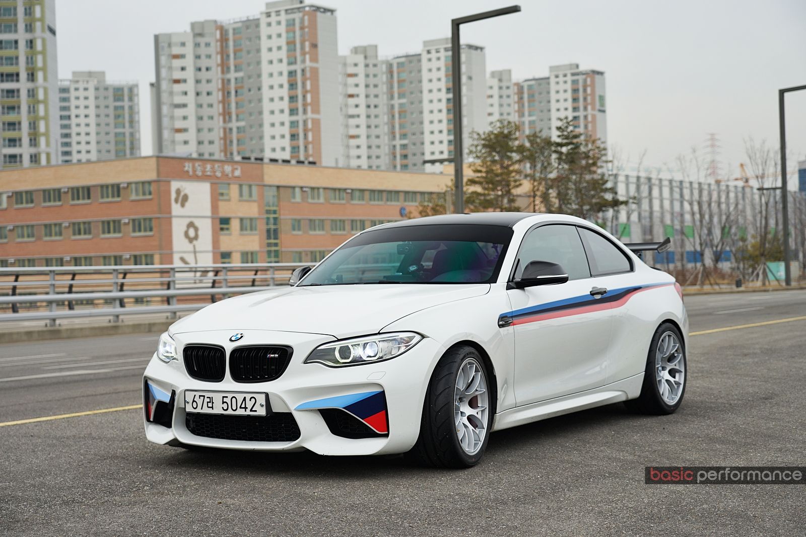 White BMW F87 M2 with 18" EC-7 Apex wheels in Race Silver