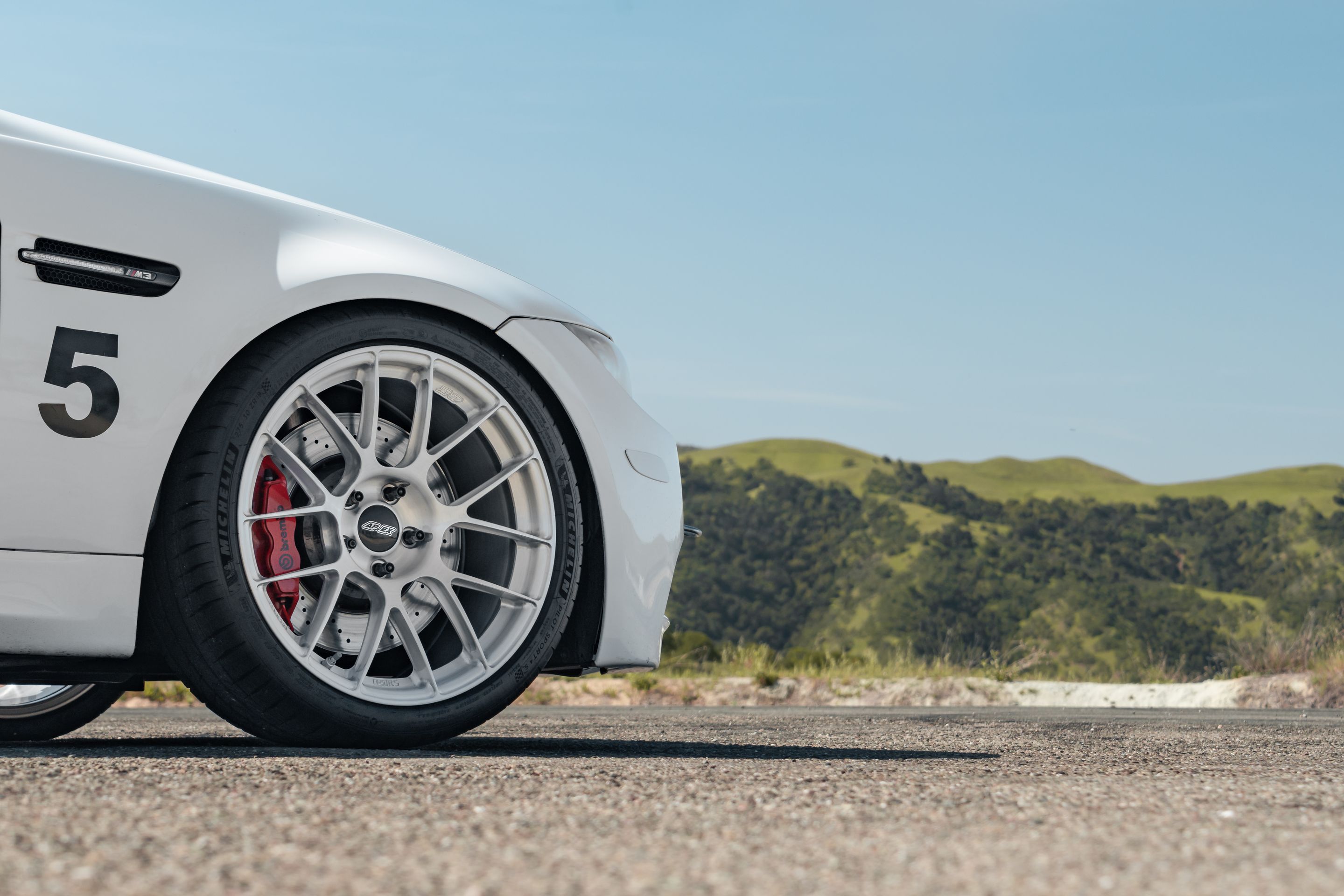 White BMW E90 Sedan M3 with 19" EC-7RS Apex wheels in Brushed Clear