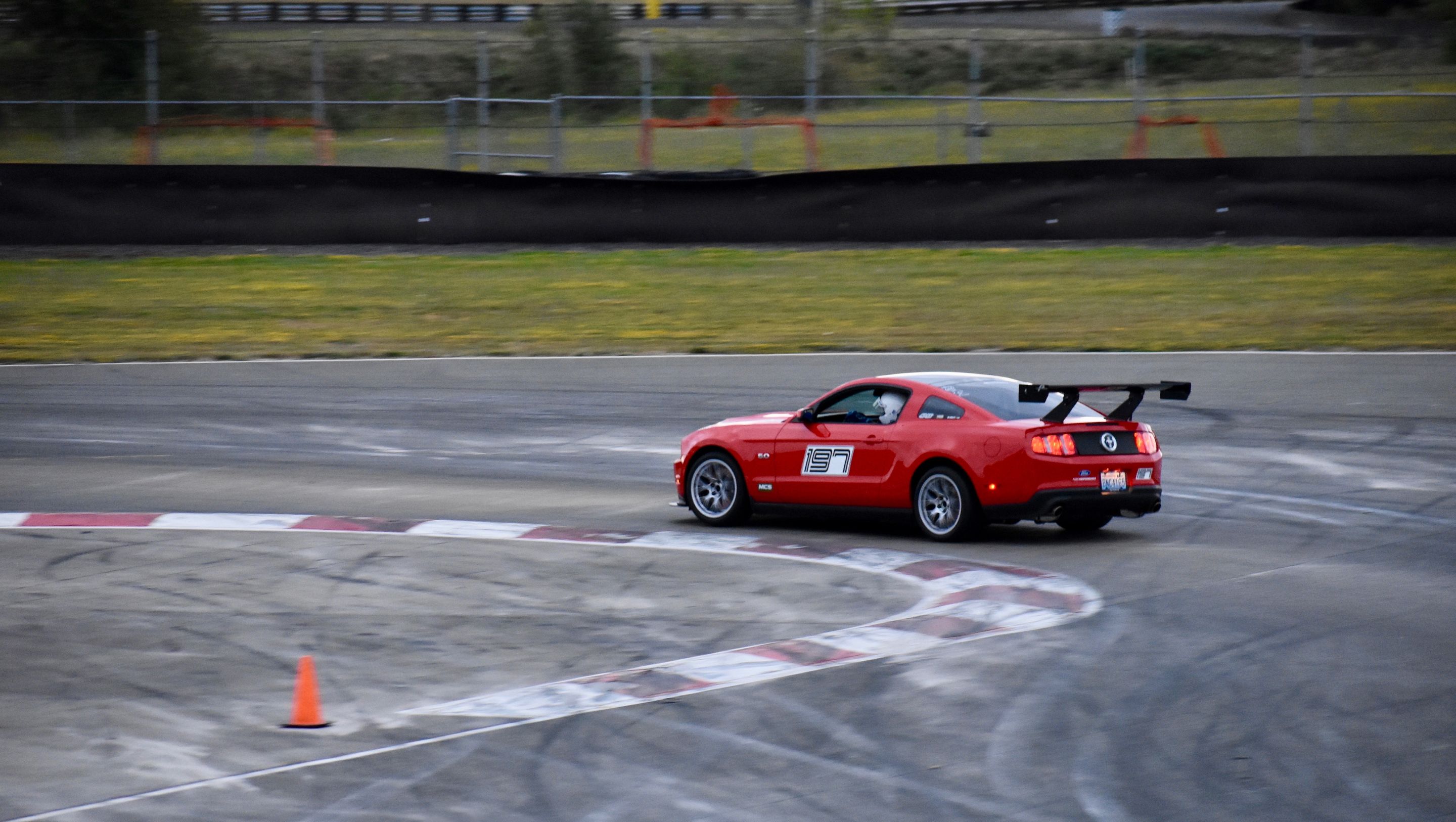 Red Ford S197 Mustang GT with 18" EC-7 Apex wheels in Race Silver