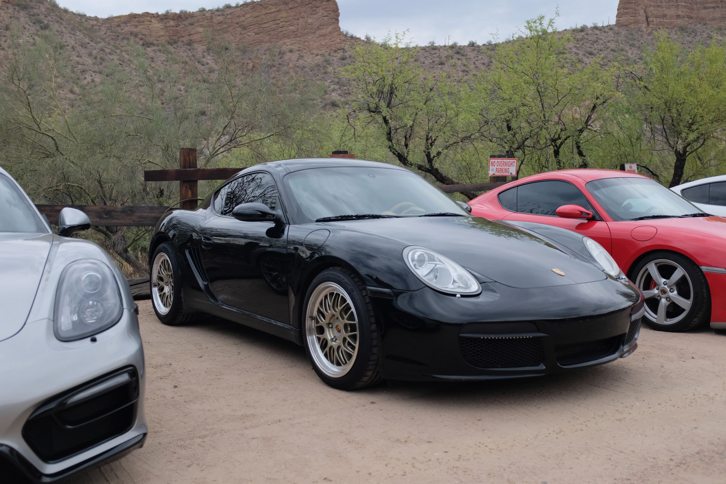 Black Porsche 987 Cayman S with 18" ML-10RT Apex wheels in Machined Lip Gloss Motorsport Gold