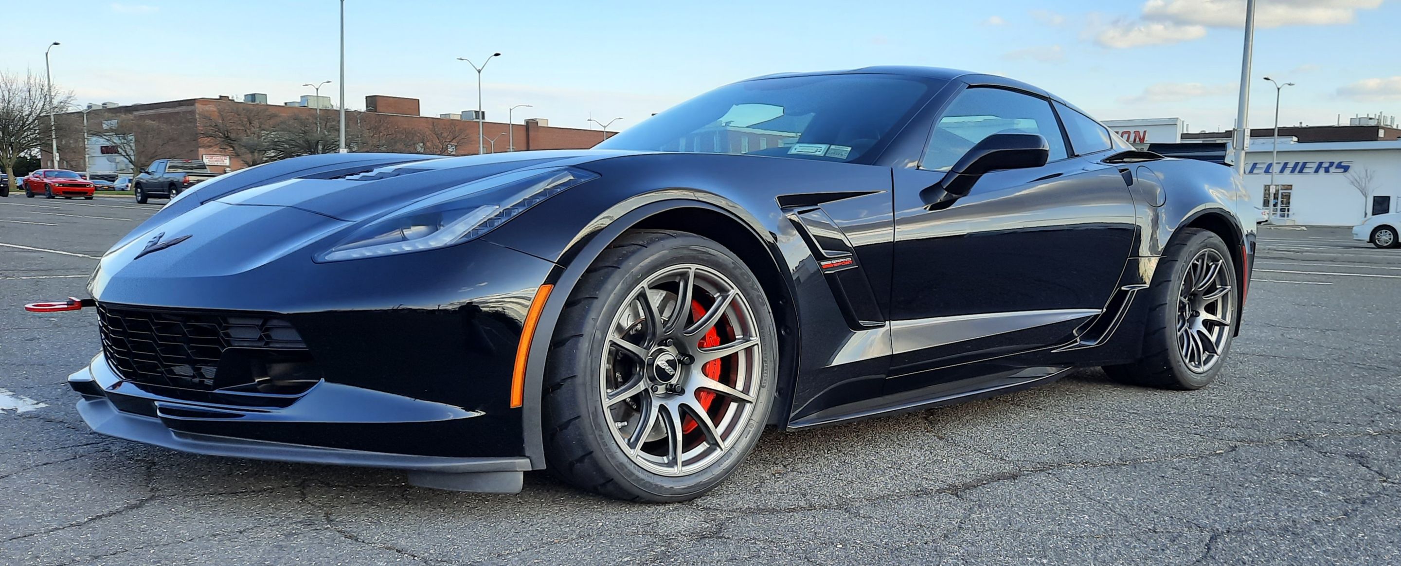 Black Chevrolet C7 Corvette Grand Sport with 18" SM-10 Apex wheels in Anthracite