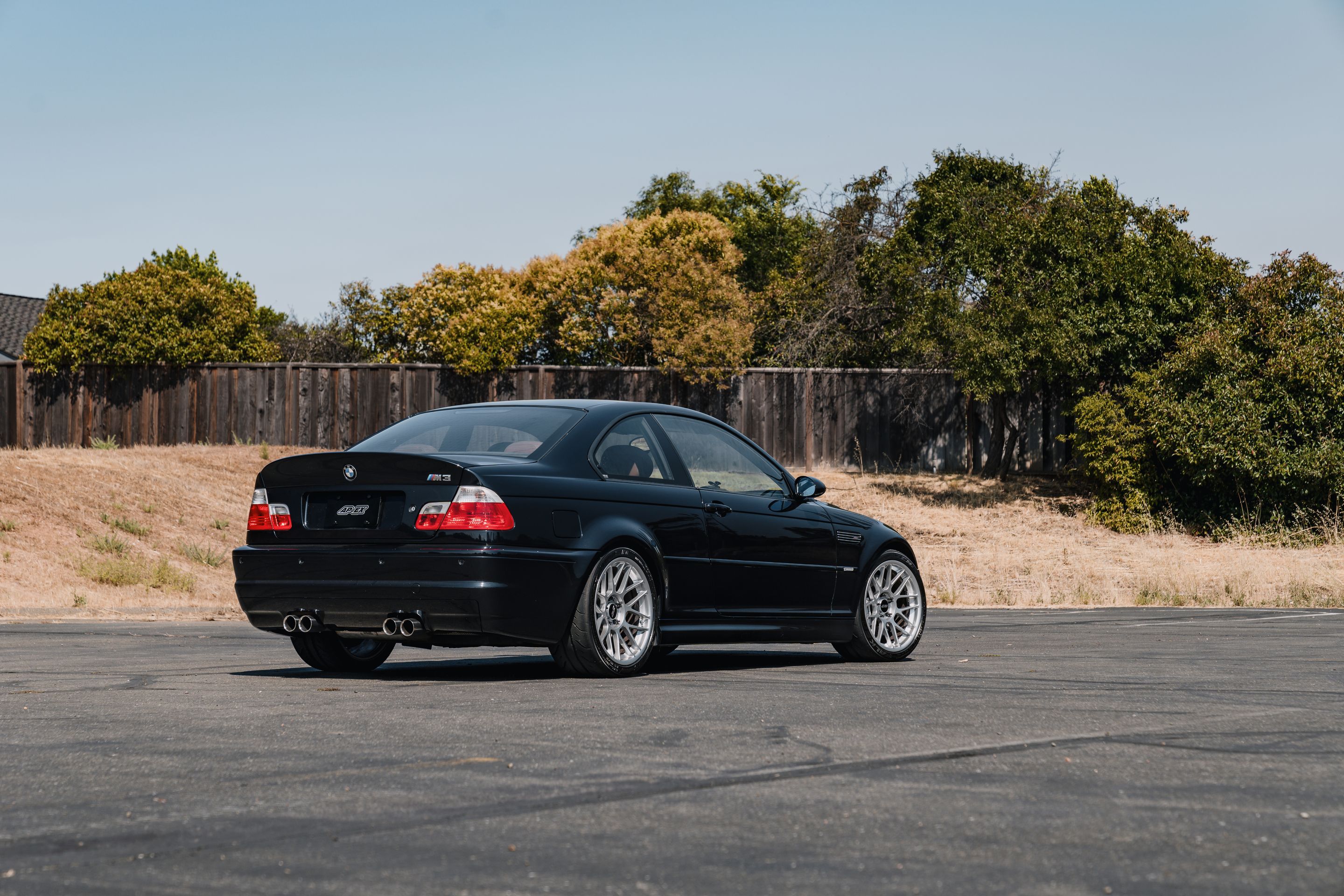 Black BMW E46 M3 with 18" ARC-8 Apex wheels in Hyper Silver