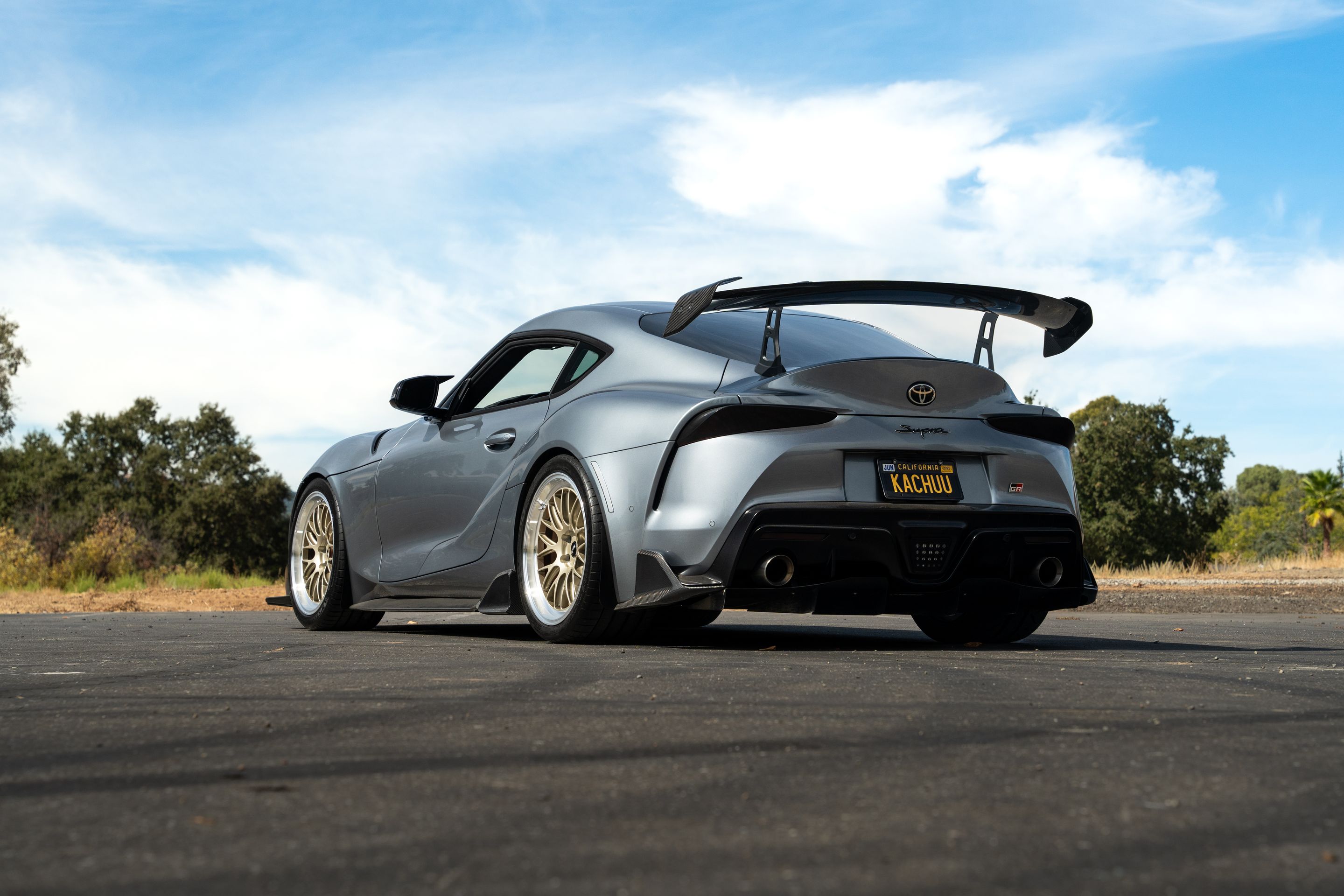 Grey Toyota GR Supra with 19" ML-10RT Apex wheels in Machined Lip Gloss Motorsport Gold