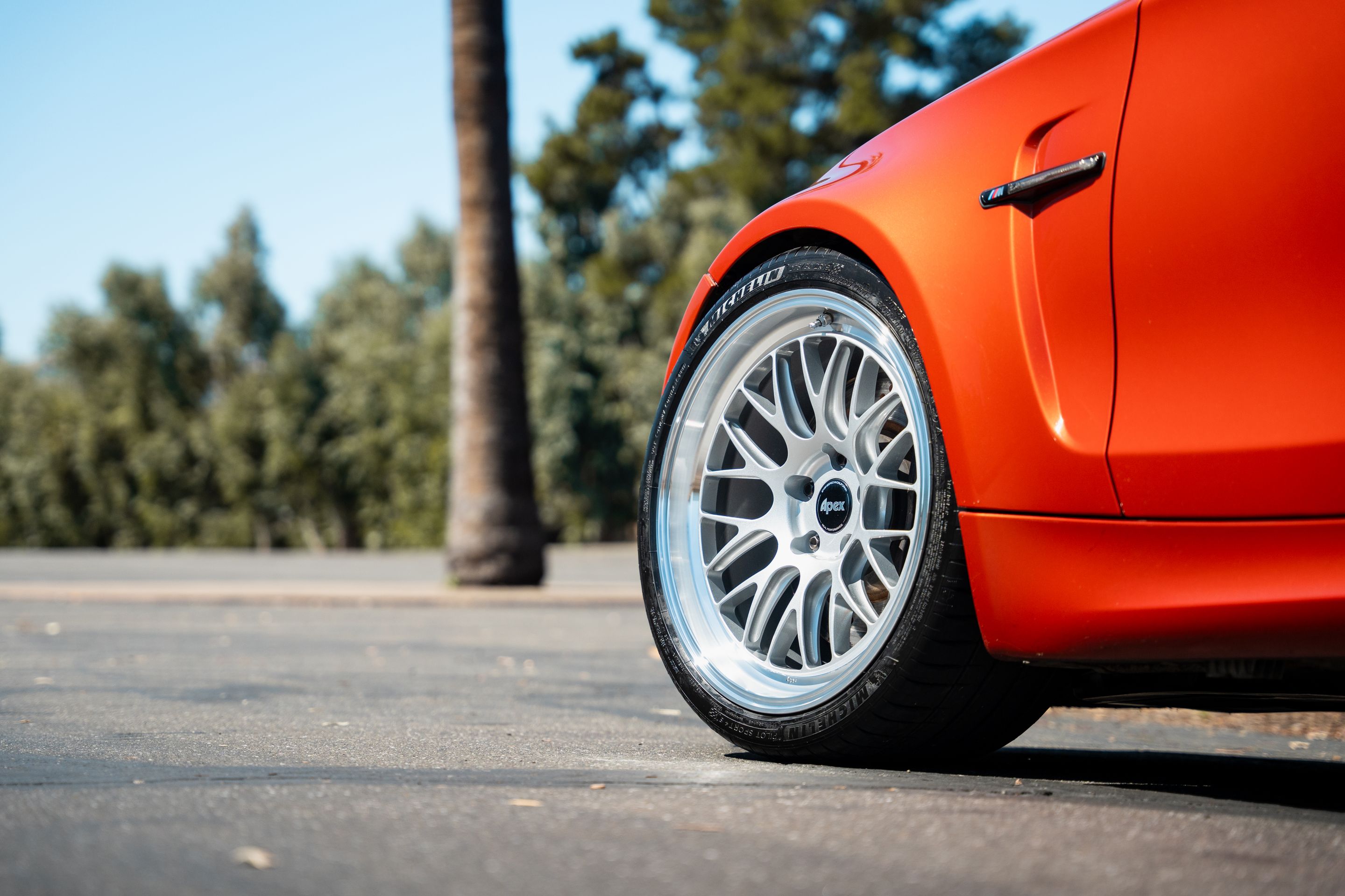 Orange BMW E82 1M with 19" ML-10RT Apex wheels in Machined Lip Race Silver