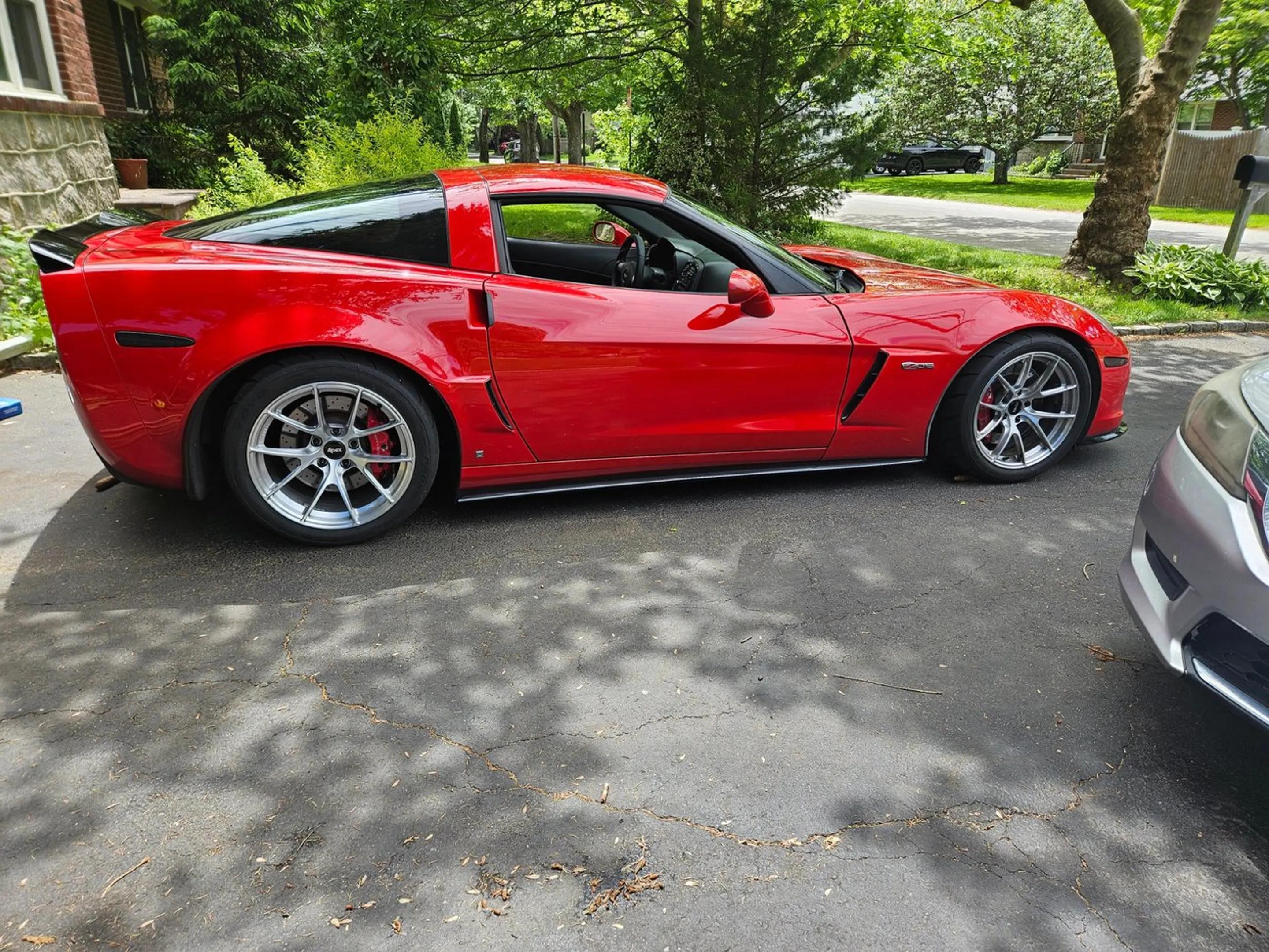 Red Chevrolet C6 Corvette Z06 with 18" VS-5RS Apex wheels in Brushed Clear