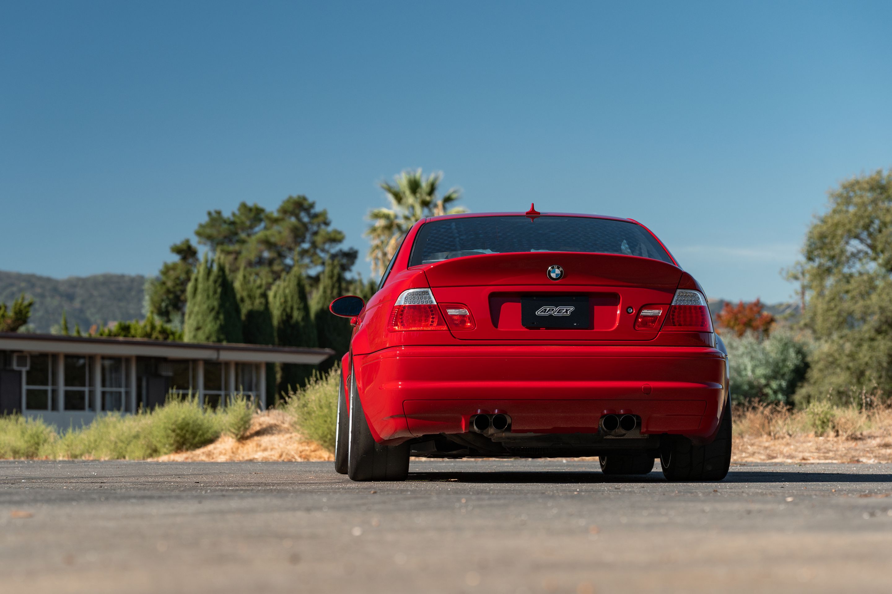 Red BMW E46 M3 with 18" ARC-8RT Apex wheels in Race Silver