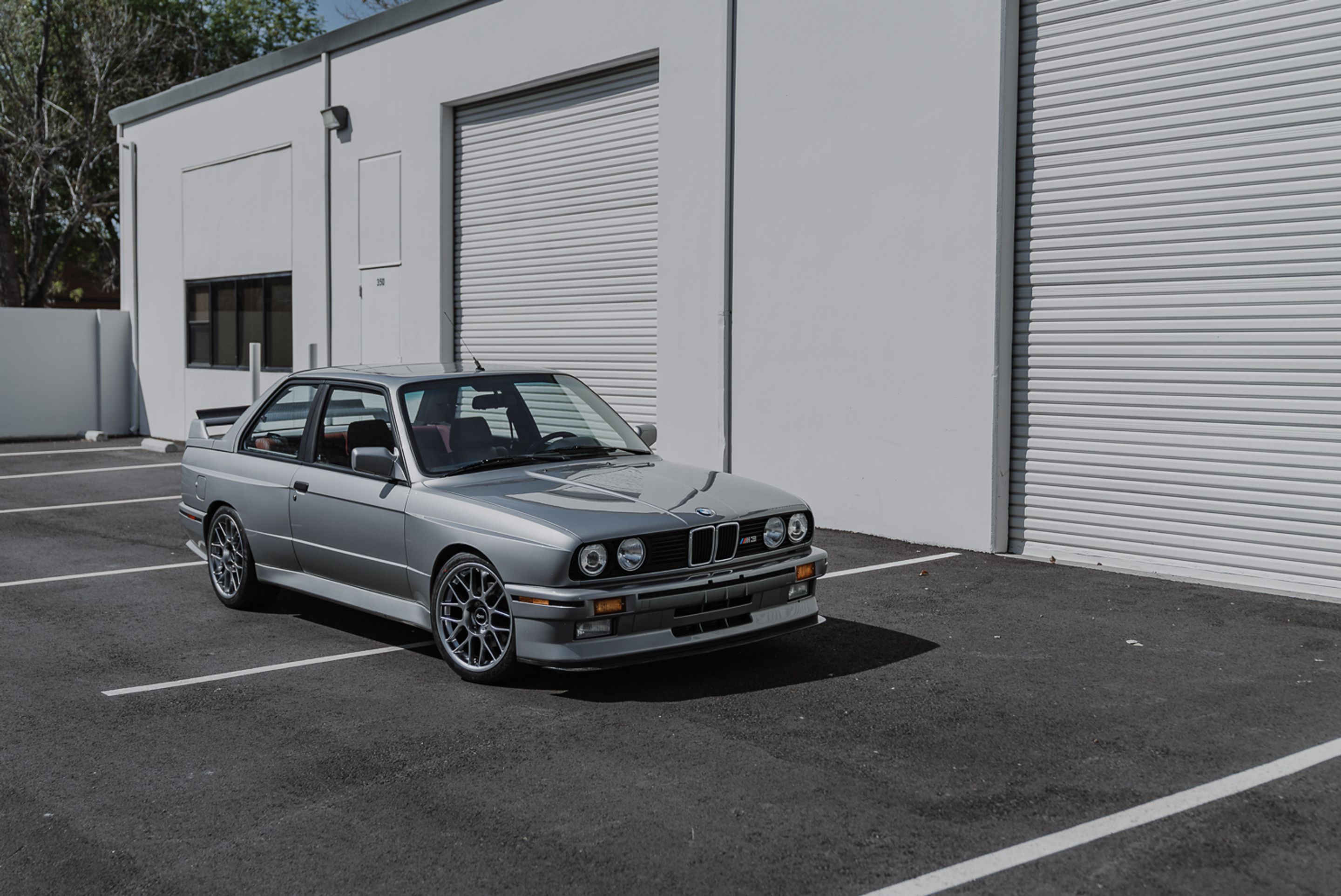 Silver BMW E30 M3 with 17" ARC-8 Apex wheels in Hyper Black