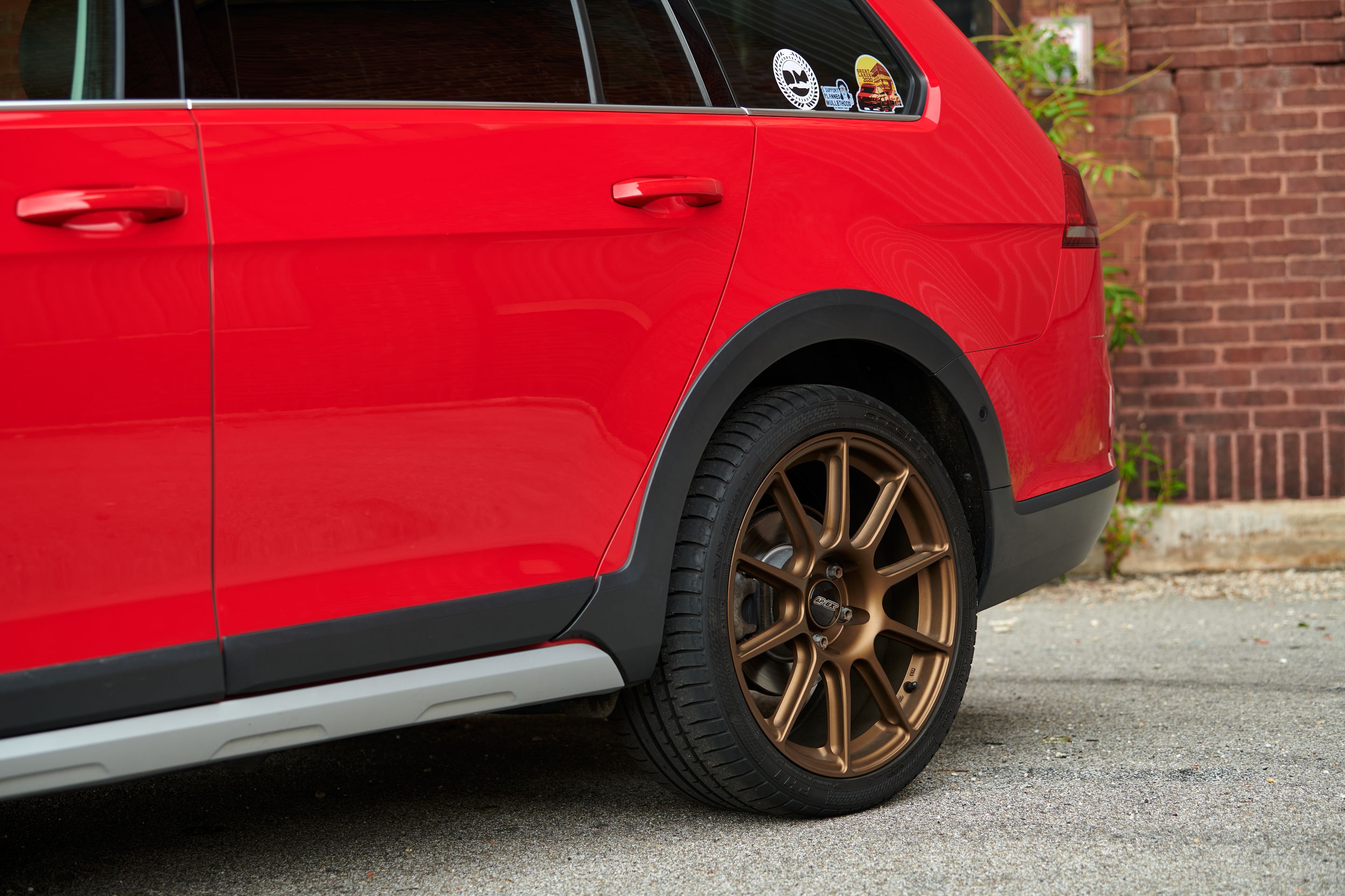Red VW MK7 Alltrack/SportWagen Alltrack with 18" SM-10 Apex wheels in Satin Bronze