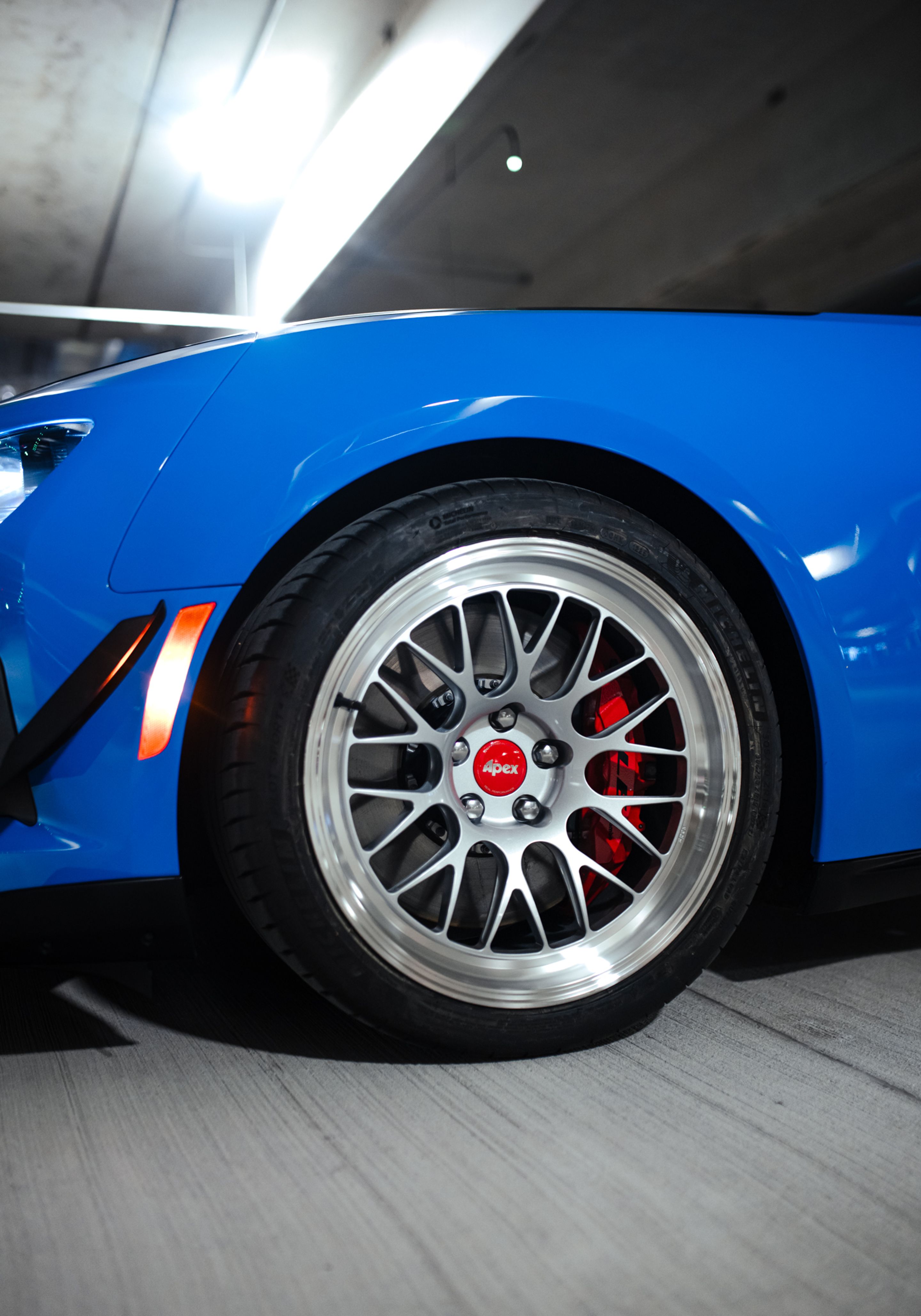 Blue Chevrolet 6th Gen Camaro ZL1 1LE with 19" ML-10RT Apex wheels in Machined Lip Race Silver