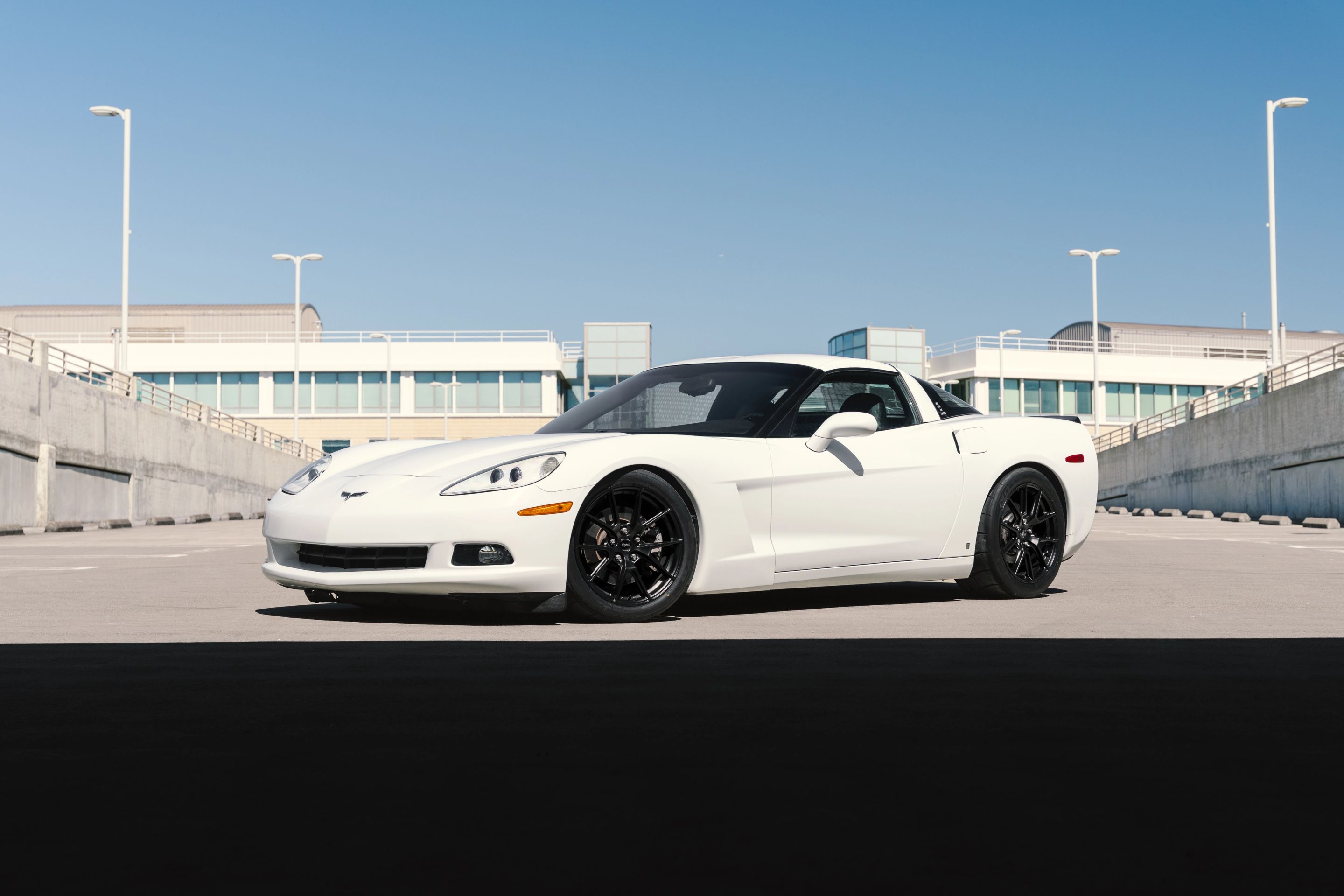 White Chevrolet C6 Corvette Base/Z51 with 18" VS-5 Apex wheels in Satin Black