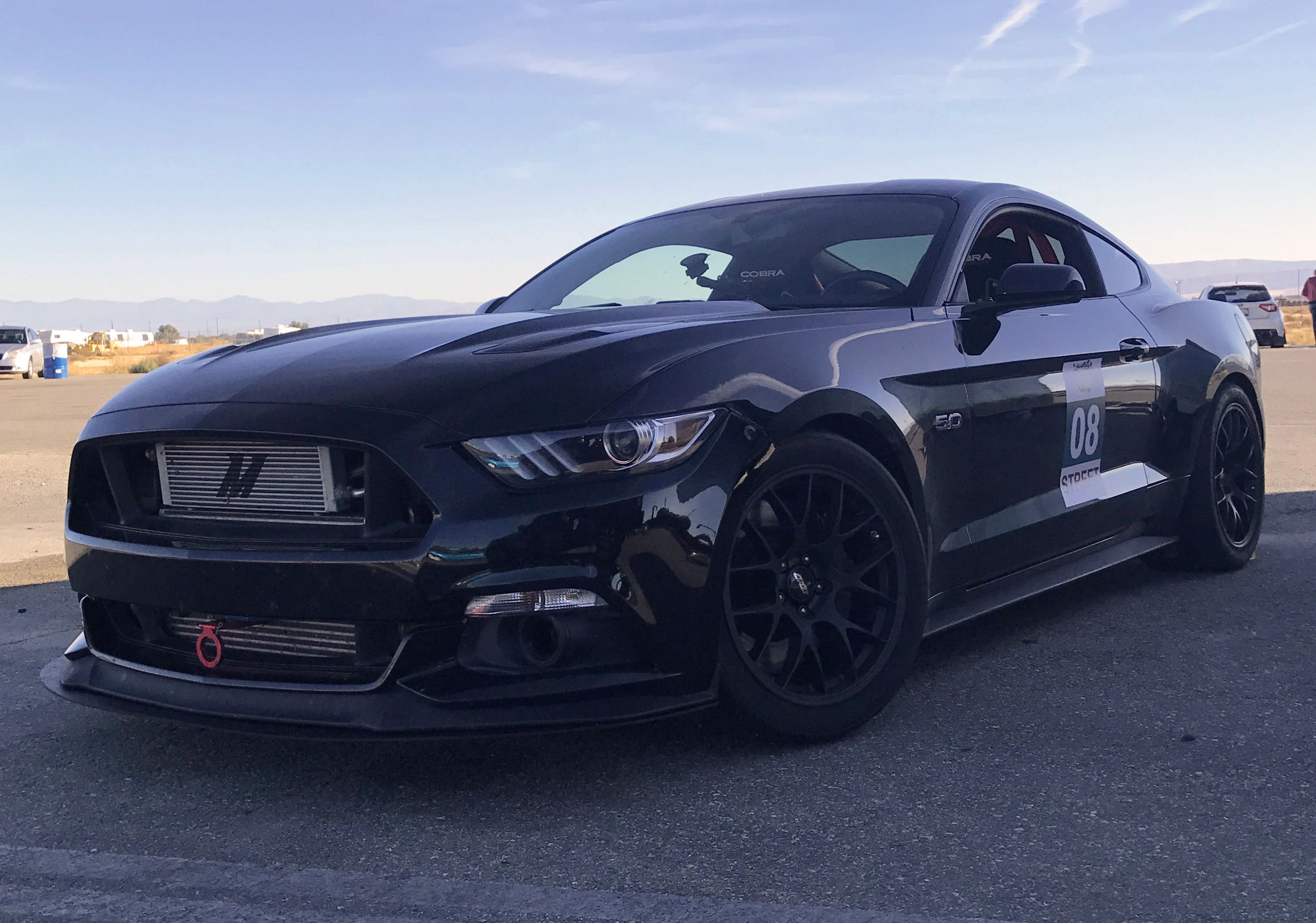 Black Ford S550 Mustang GT with 18" EC-7 Apex wheels in Satin Black