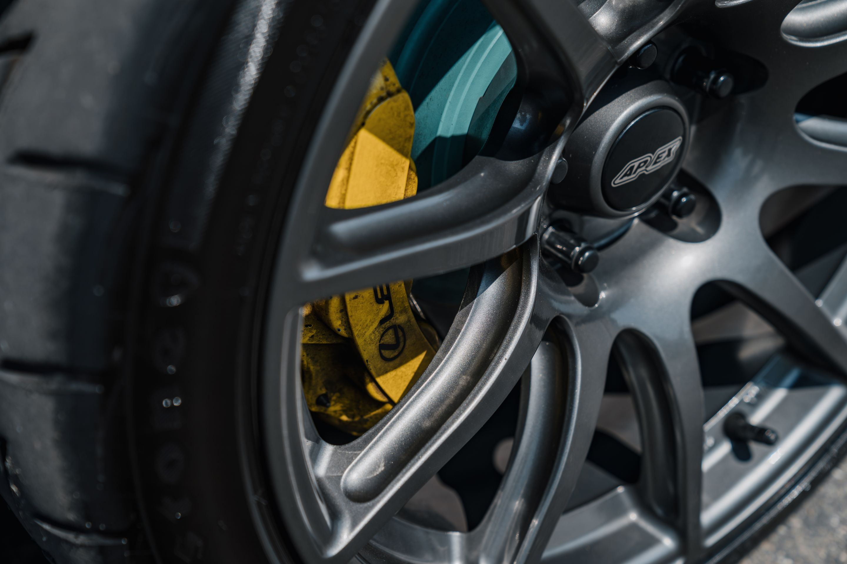 Red Lexus USE20 IS-F with 18" SM-10 Apex wheels in Anthracite