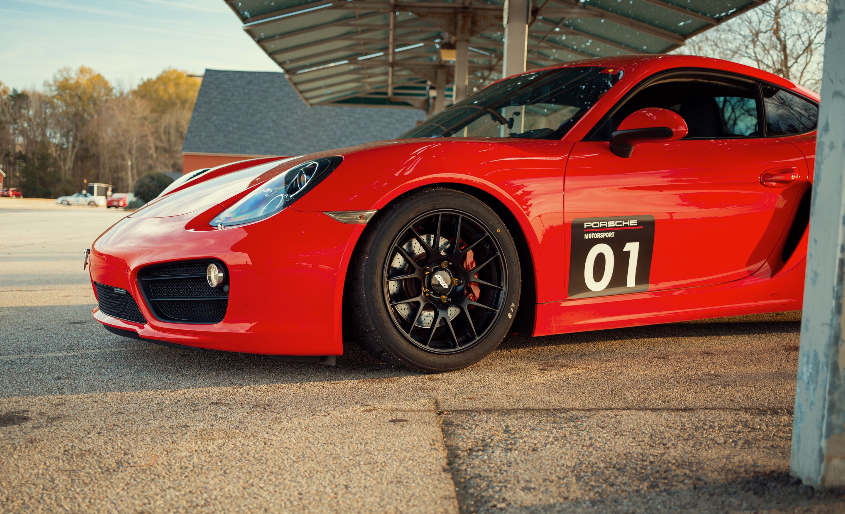 Red Porsche 981 Cayman S with 18" EC-7R Apex wheels in Satin Black