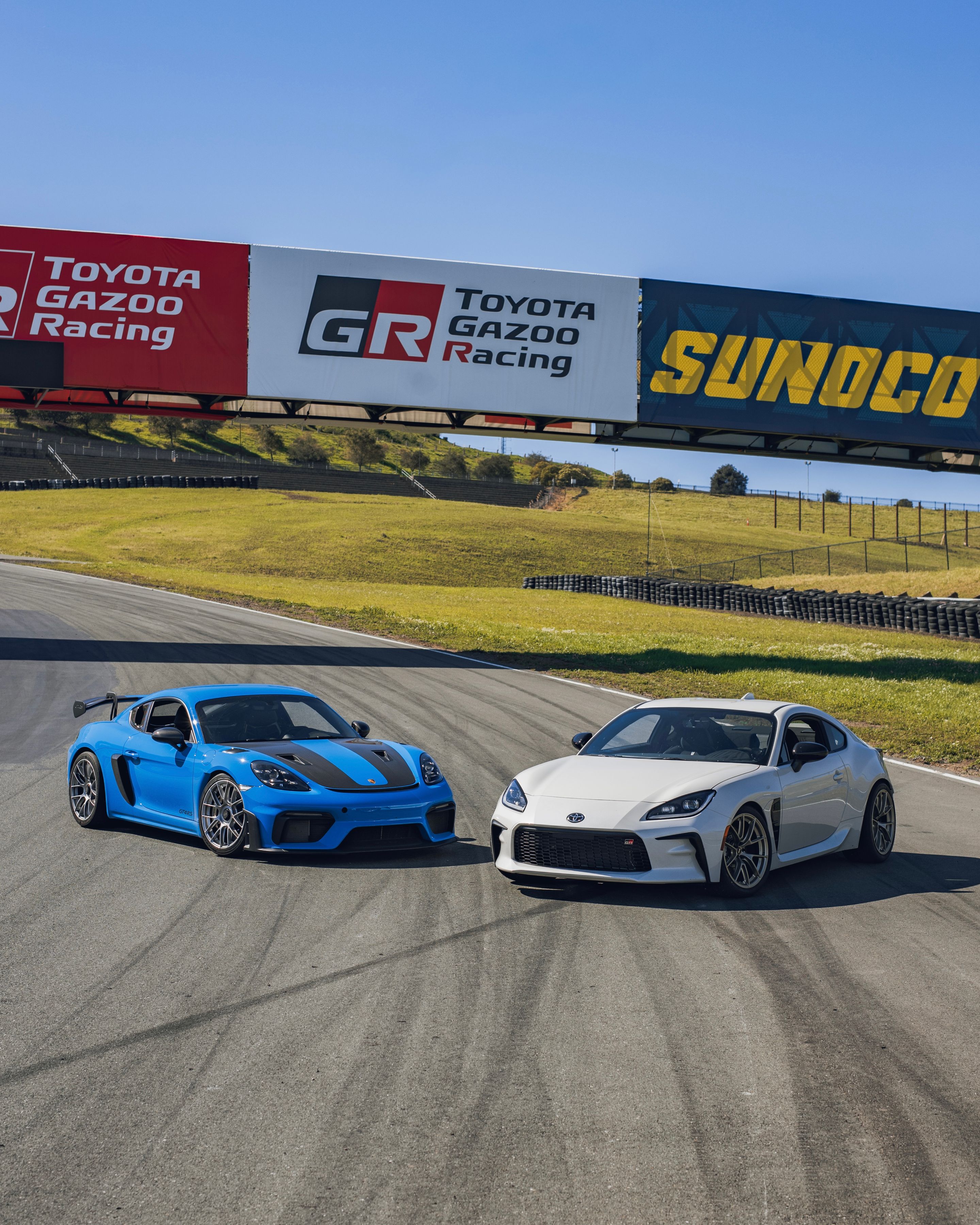 Blue Porsche 718 Cayman GT4 RS with 19" EC-7RS Apex wheels in Race Silver