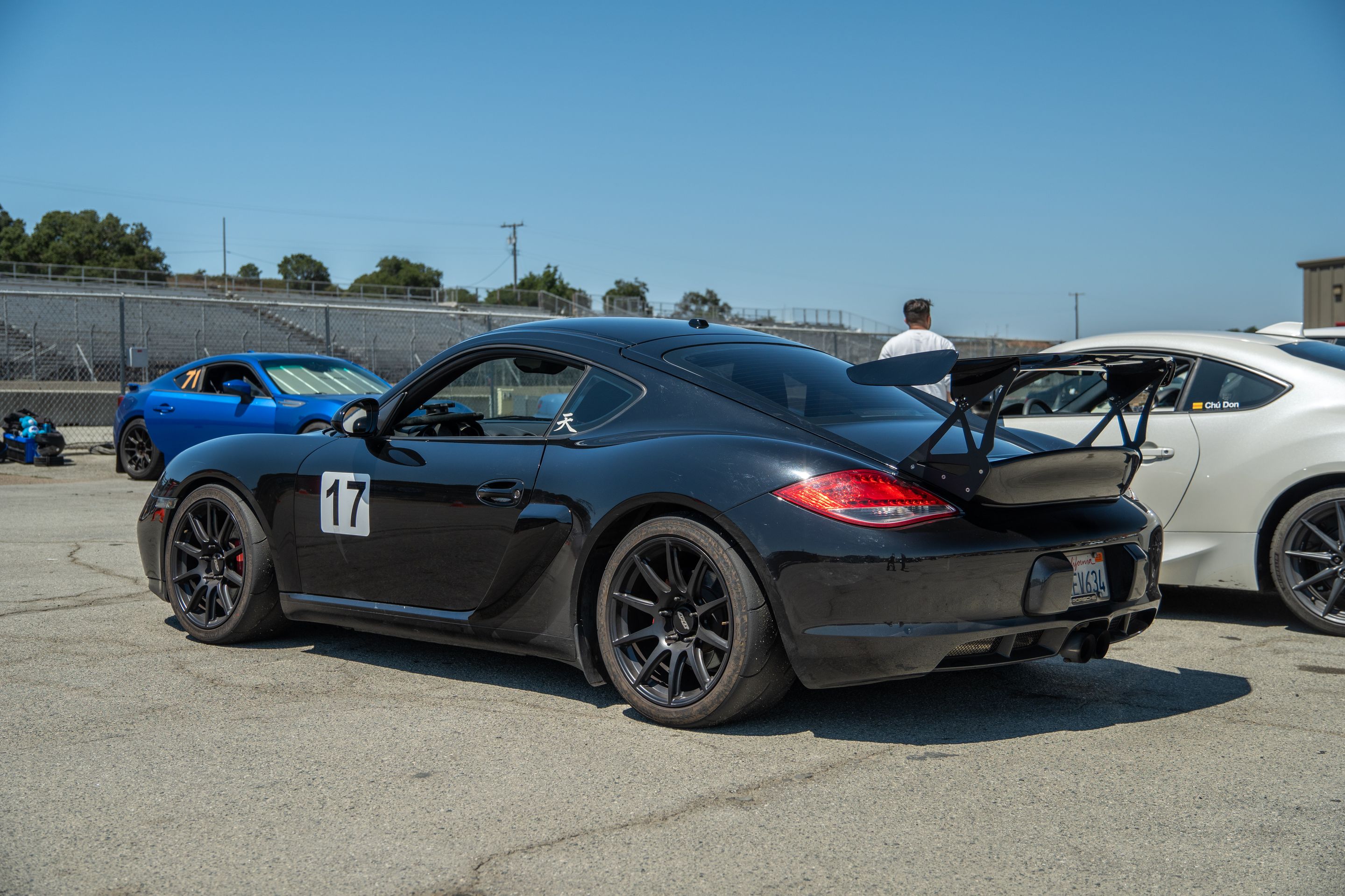 Black Porsche 987 Cayman S with 18" SM-10 Apex wheels in Satin Black