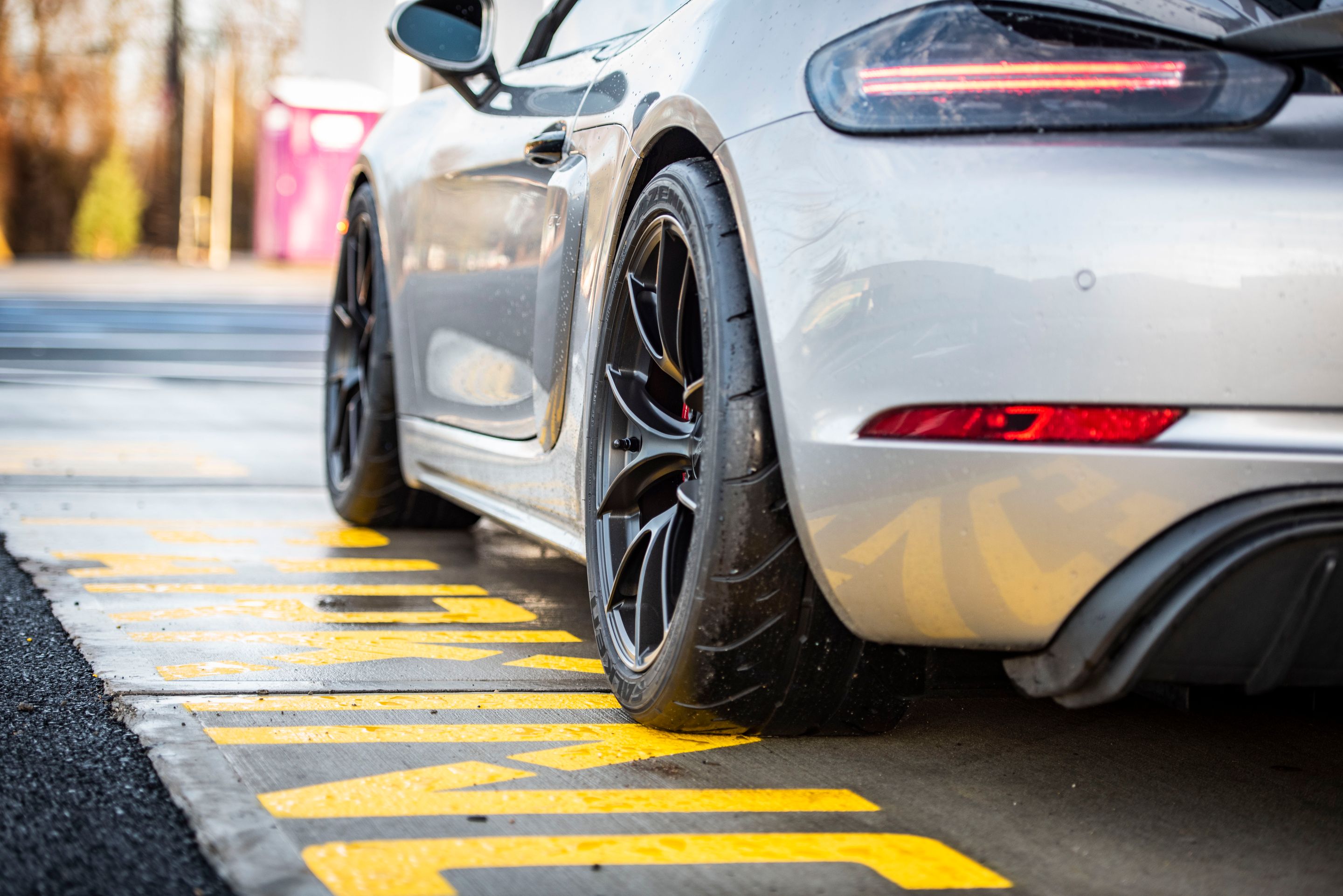 Silver Porsche 718 Cayman GT4 with 19" VS-5RS Apex wheels in Satin Black
