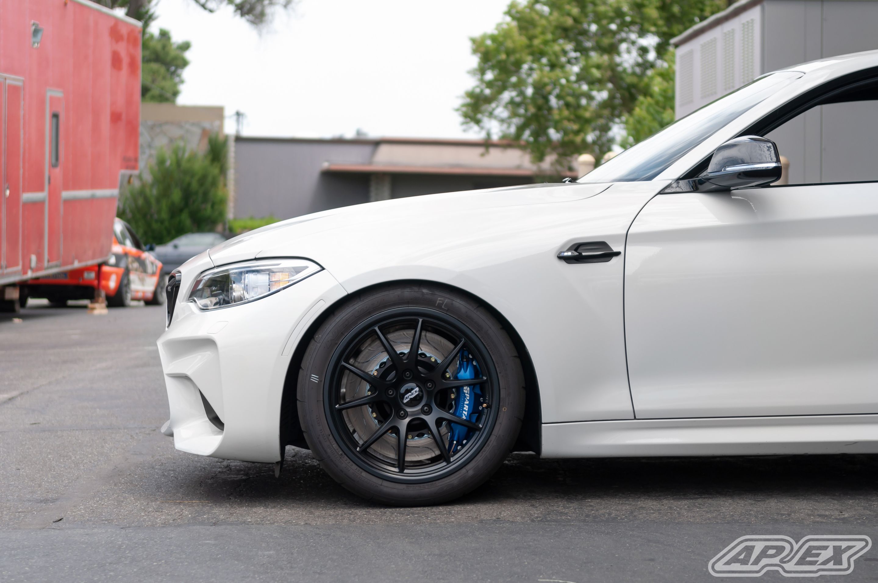 White BMW F87 M2 with 18" FL-5 Apex wheels in Satin Black