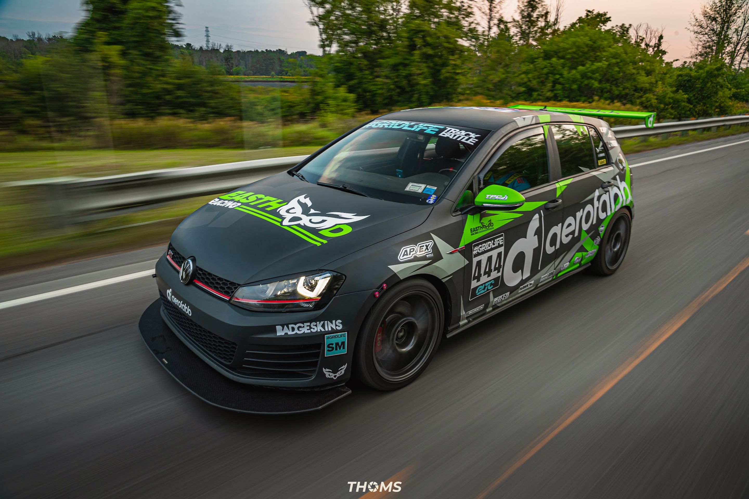 Race Livery VW MK7 GTI with 18" SM-10 Apex wheels in Satin Black