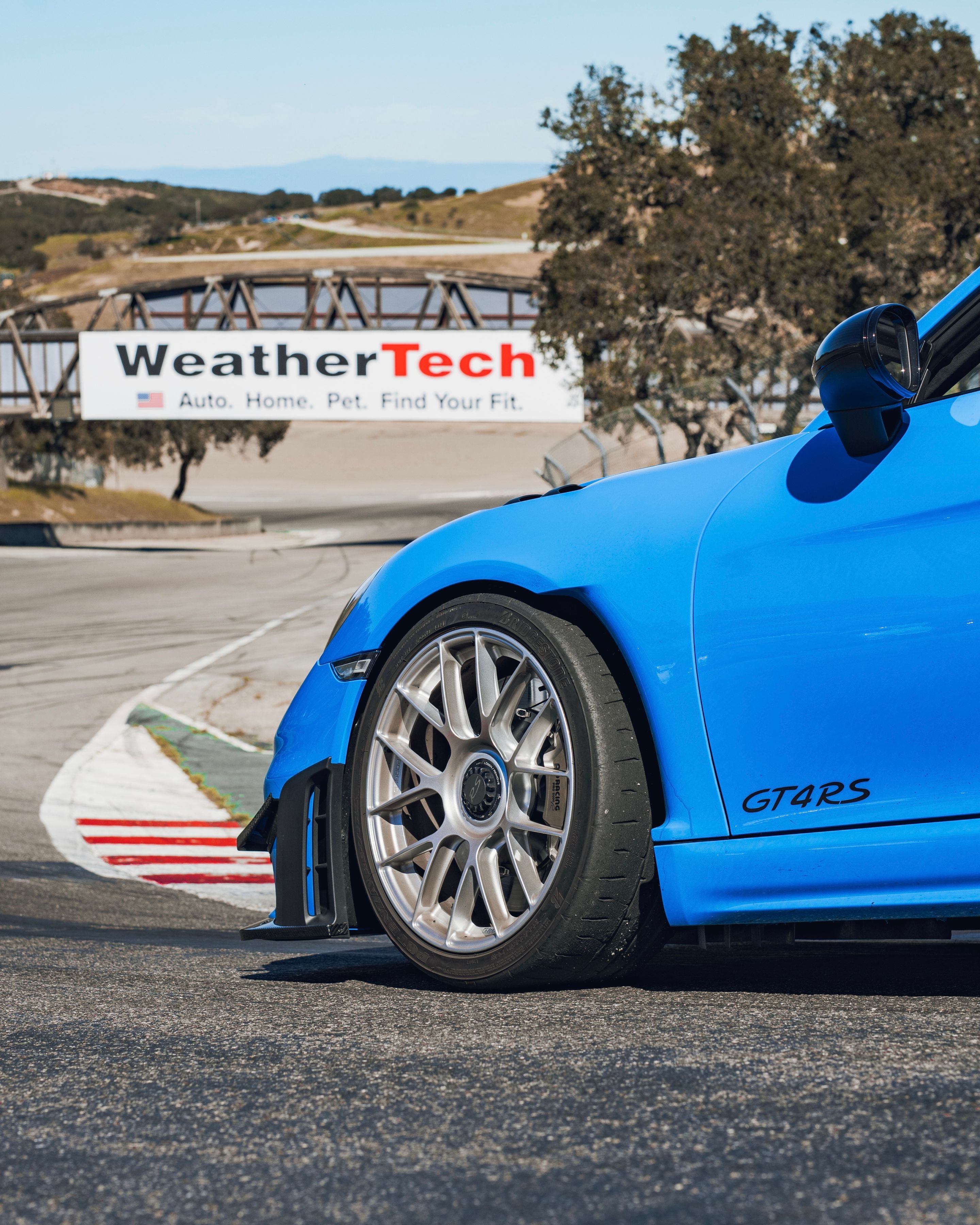 Blue Porsche 718 Cayman GT4 RS with 19" EC-7RS Apex wheels in Race Silver