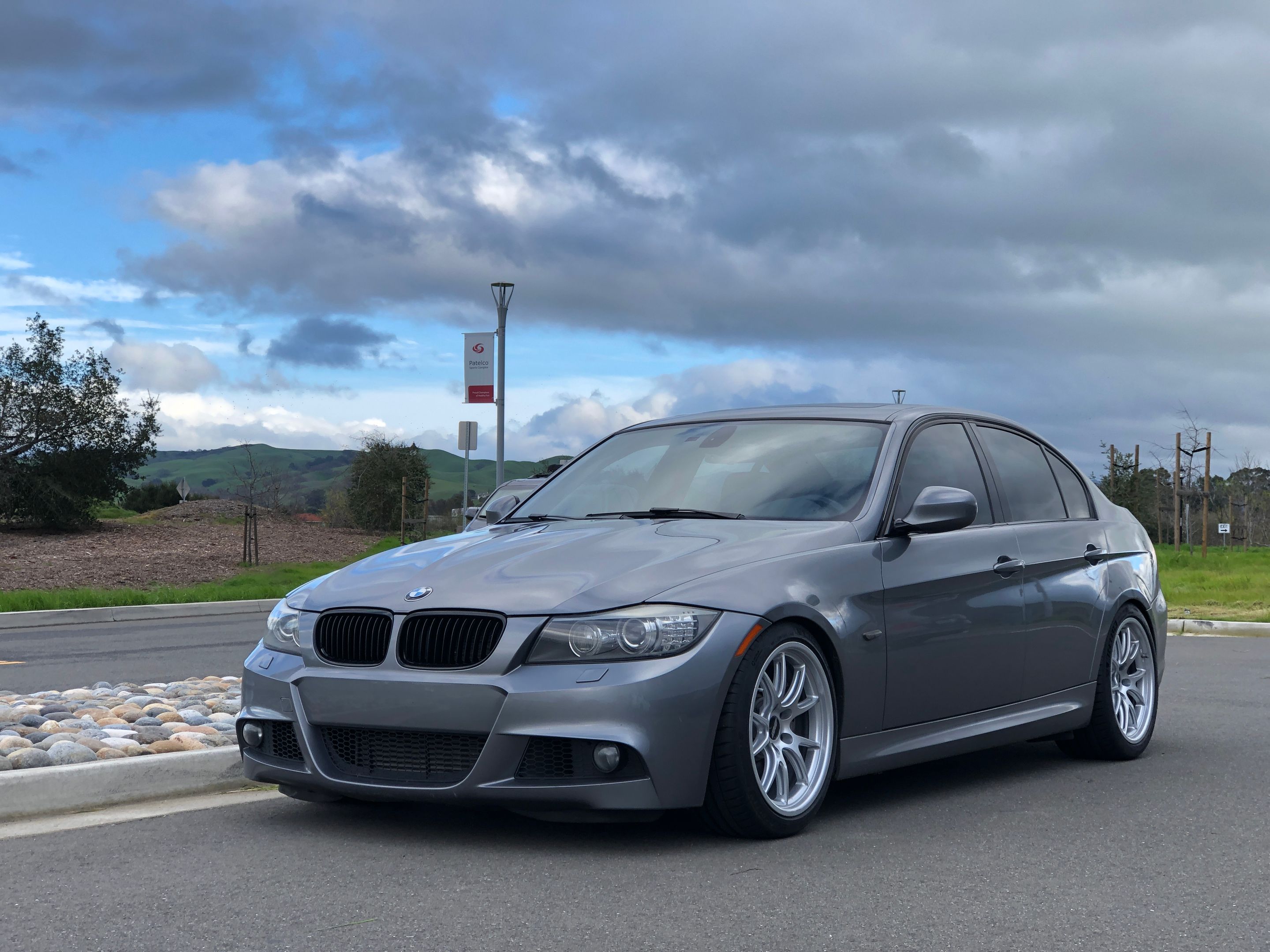 Grey BMW E90 LCI Sedan 3 Series with 18" FL-5 Apex wheels in Race Silver