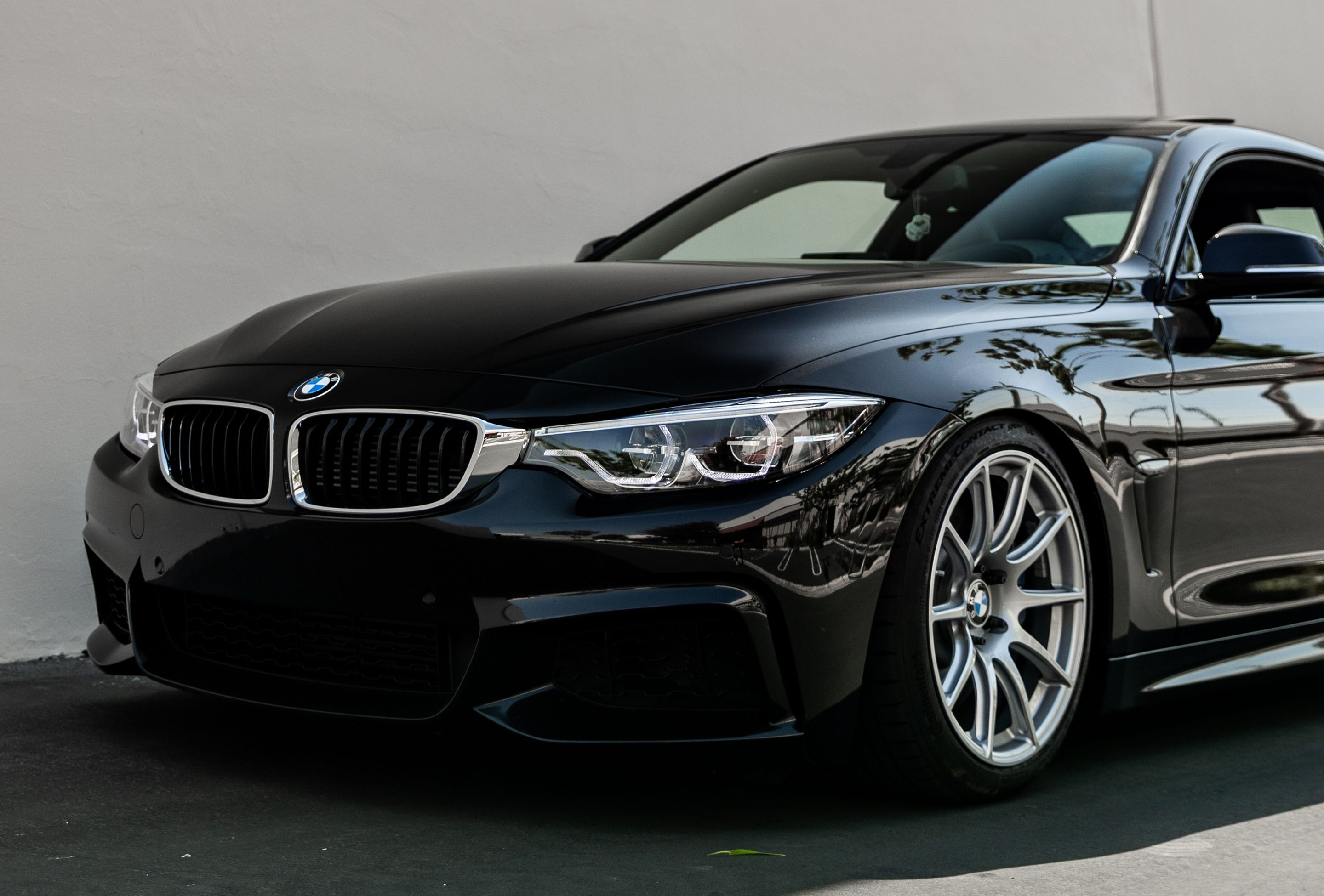 Black BMW F32 Coupe 4 Series with 18" SM-10 Apex wheels in Race Silver