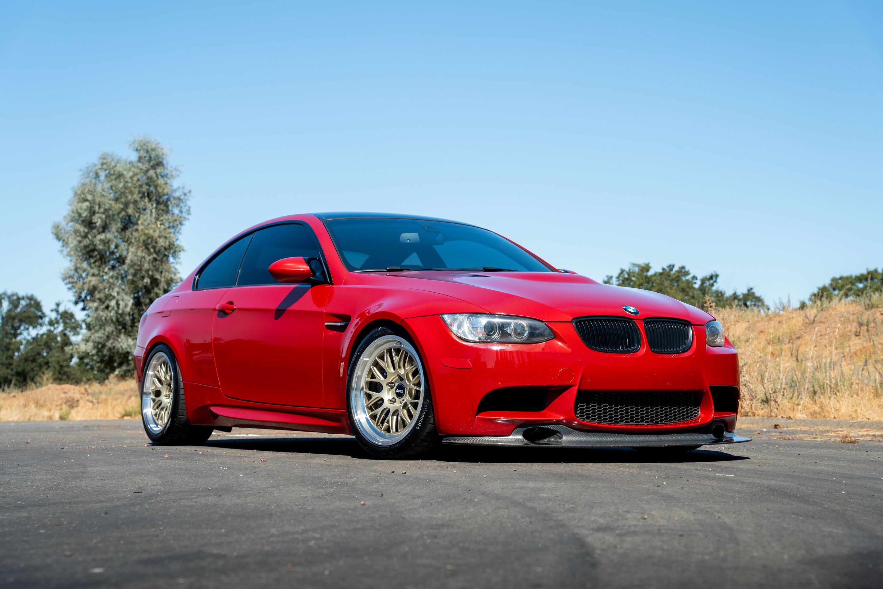 Red BMW E92 Coupe M3 with 18" ML-10RT Apex wheels in Machined Lip Gloss Motorsport Gold