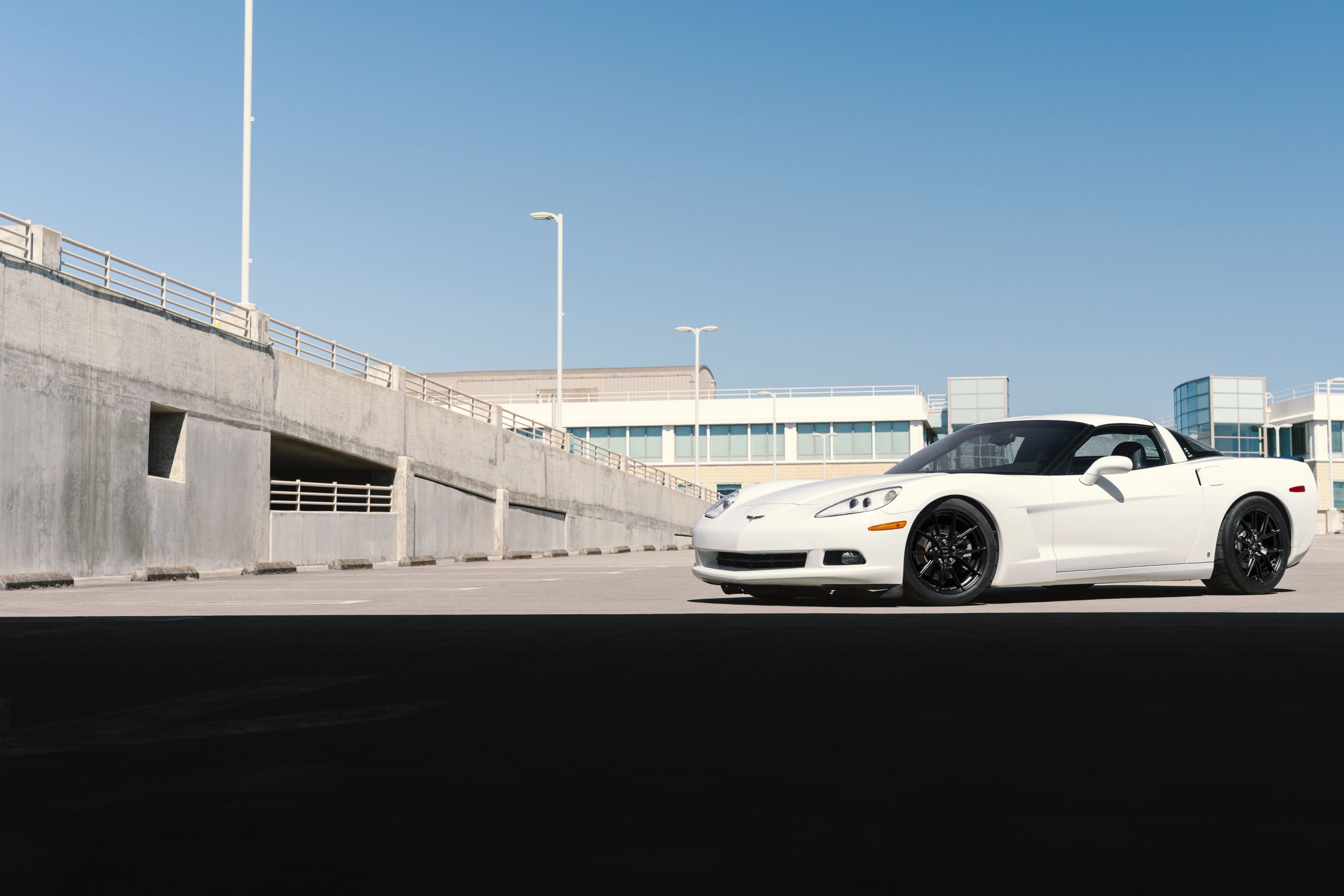 White Chevrolet C6 Corvette Base/Z51 with 18" VS-5 Apex wheels in Satin Black