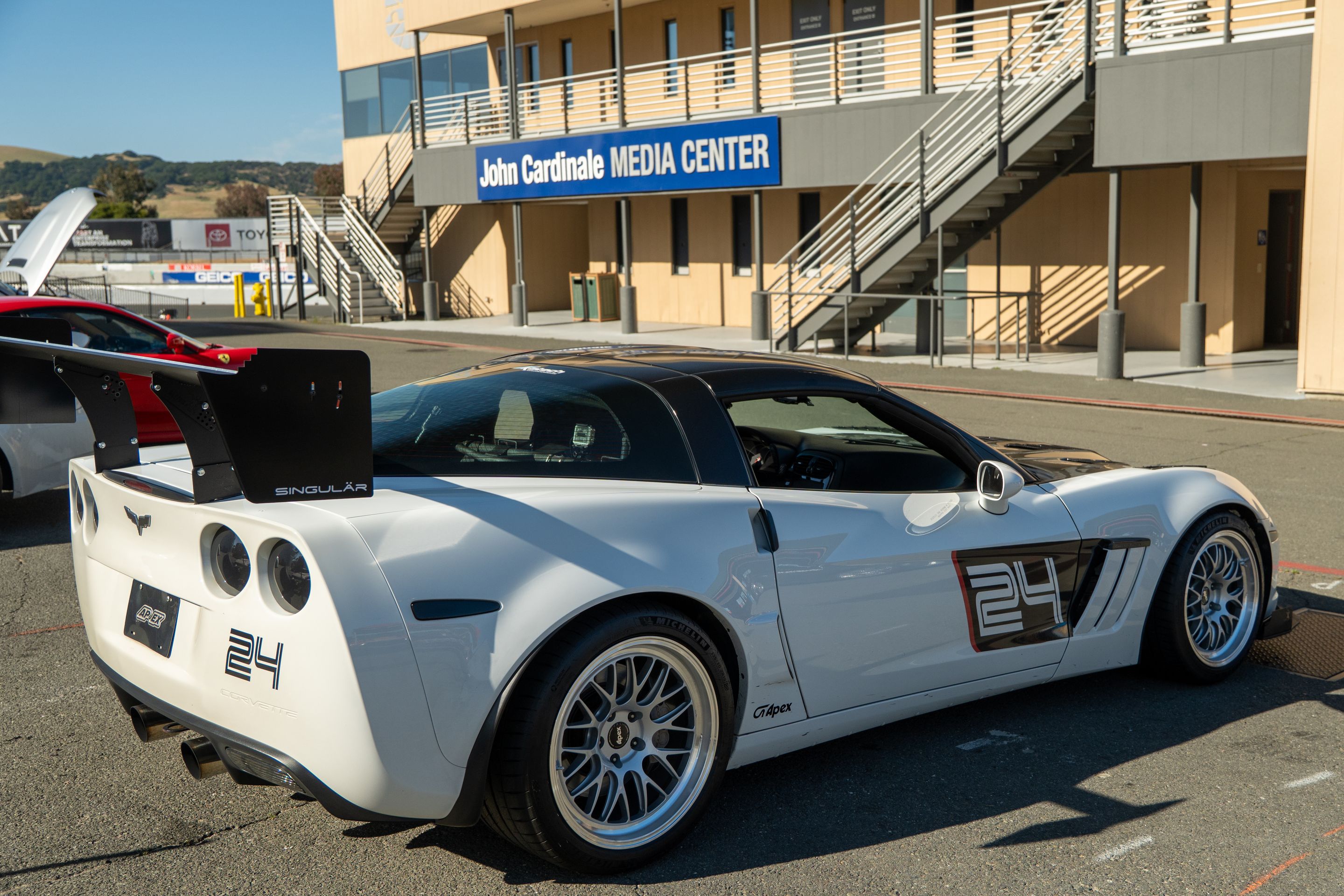 White Chevrolet C6 Corvette Grand Sport with 18"/19" ML-10RT Apex wheels in Machined Lip Race Silver