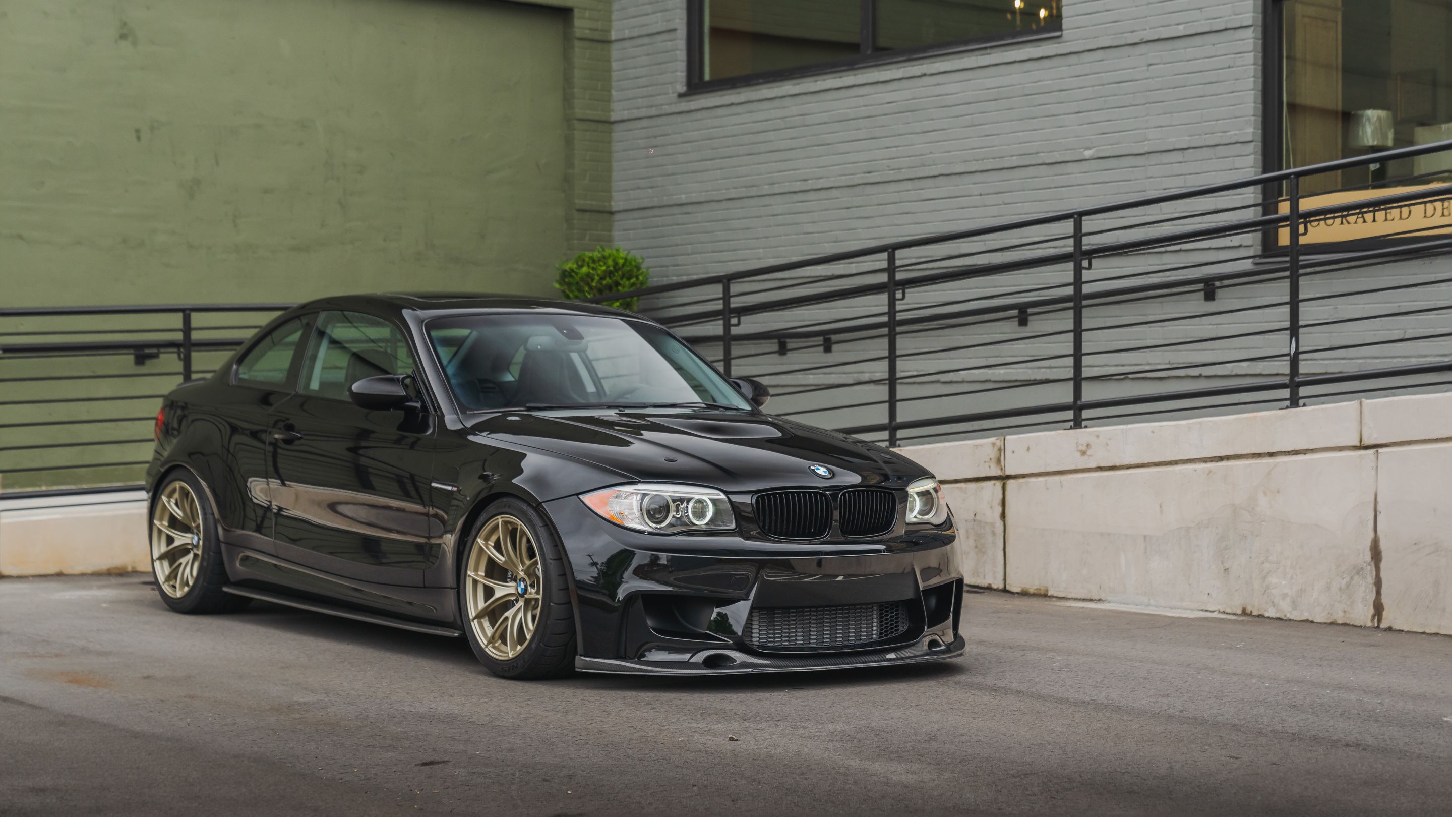 Black BMW E82 Coupe 1 Series with 18" VS-5RS Apex wheels in Motorsport Gold