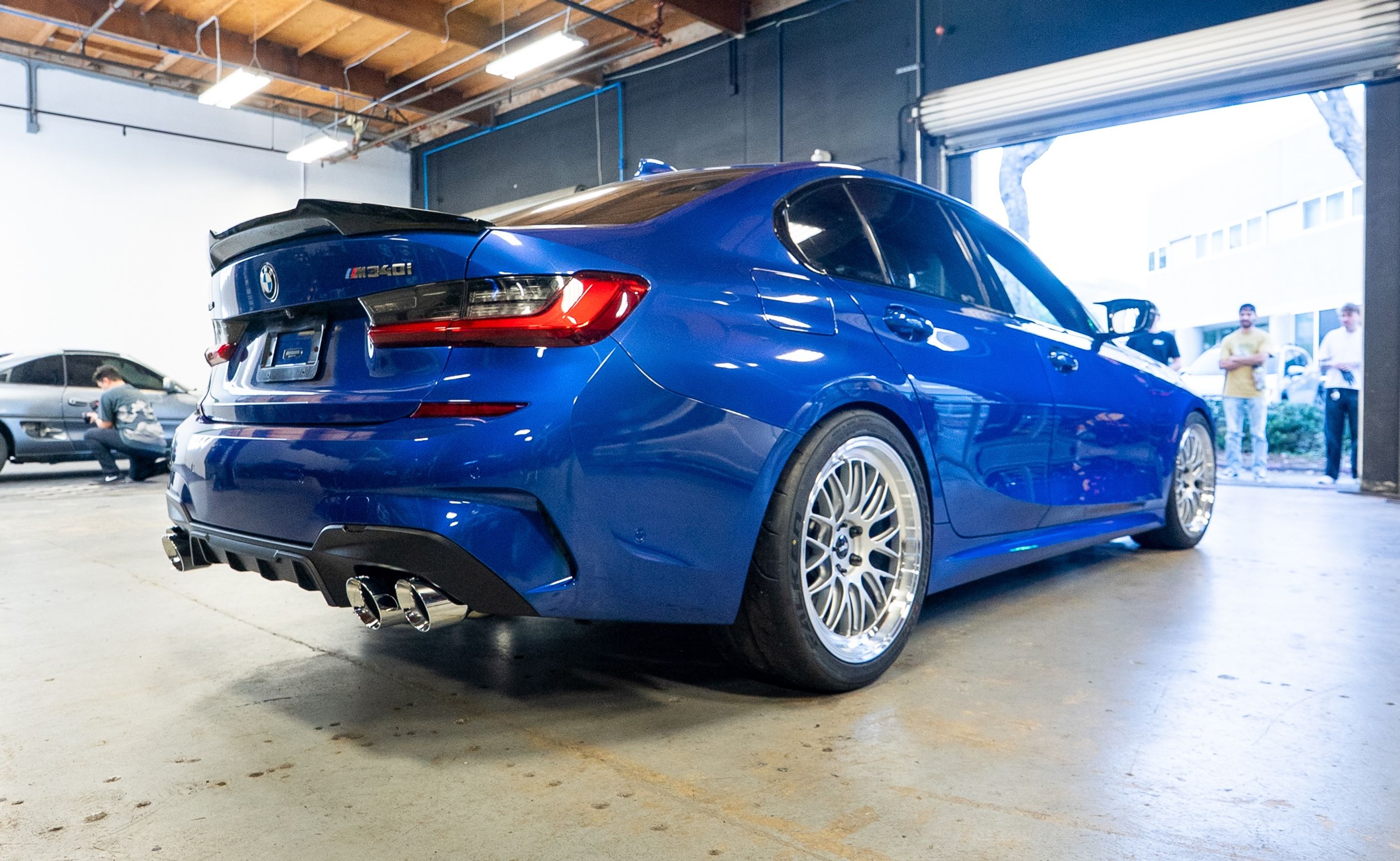 Blue BMW G20 Sedan 3 Series with 19" ML-10RT Apex wheels in Machined Lip Race Silver