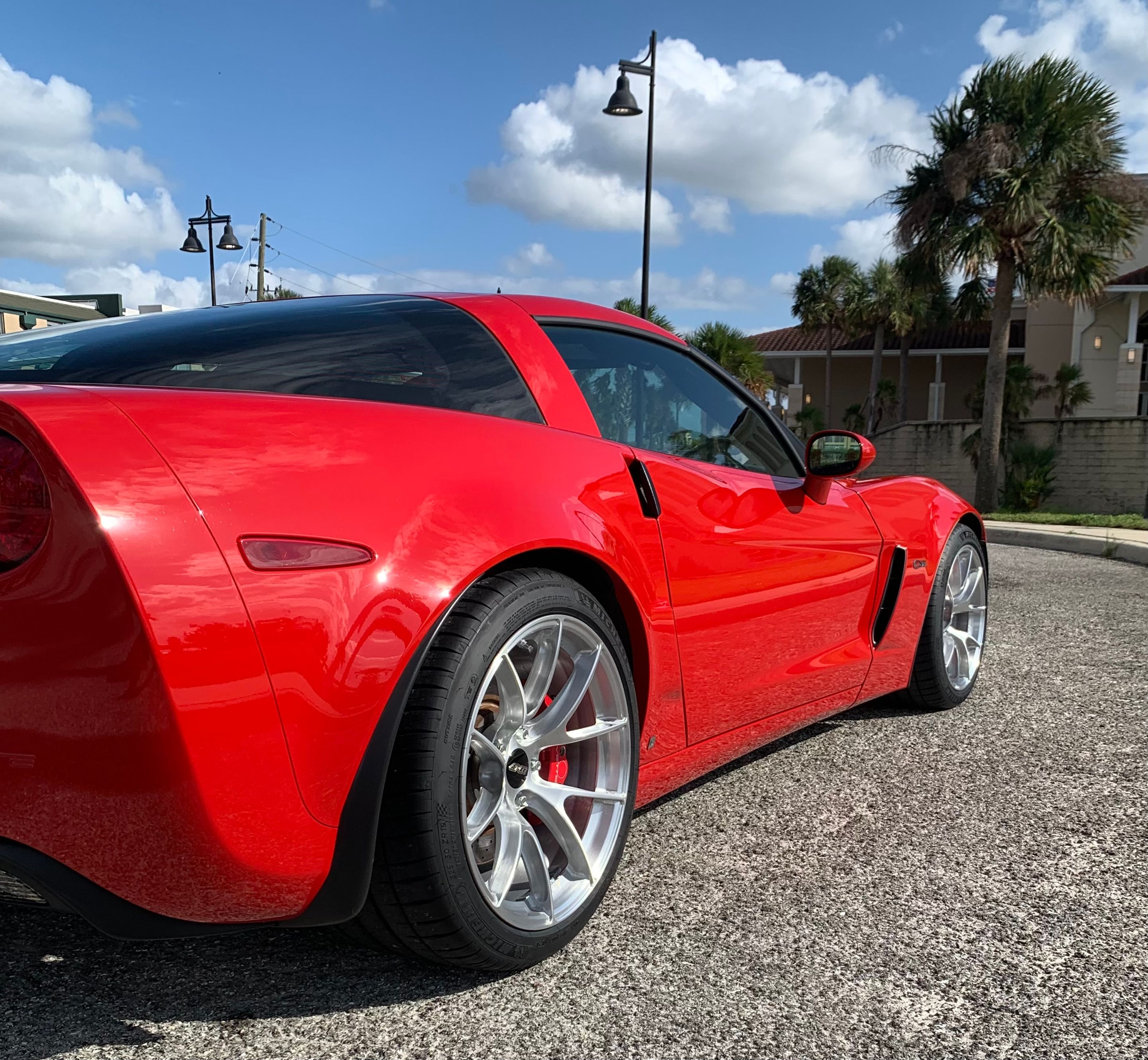 Red Chevrolet C6 Corvette Z06 with 18"/19" VS-5RS Apex wheels in Brushed Clear