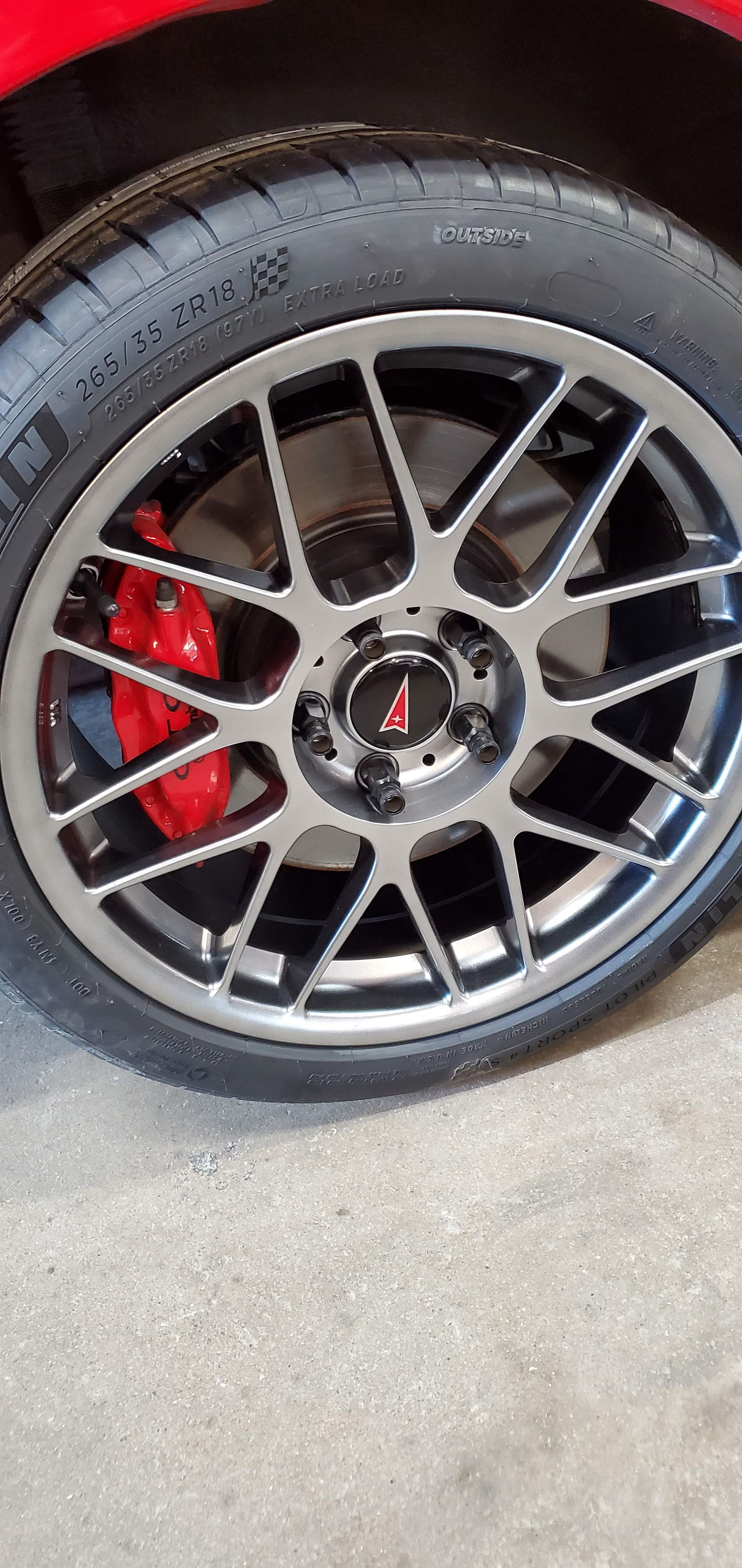 Red Pontiac 5th Gen GTO with 18" ARC-8 Apex wheels in Anthracite