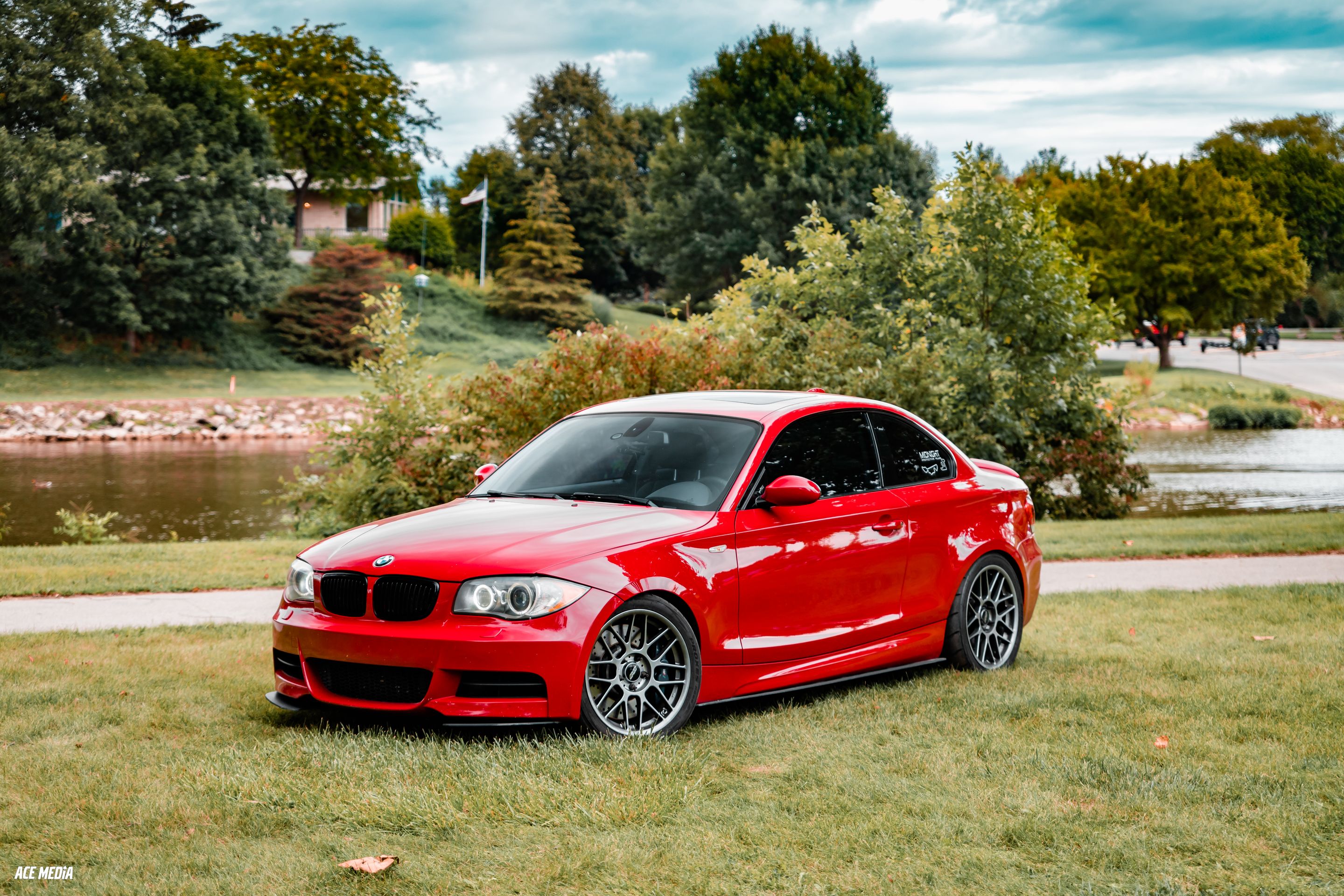 Red BMW E82 Coupe 1 Series with 18" ARC-8 Apex wheels in Hyper Black