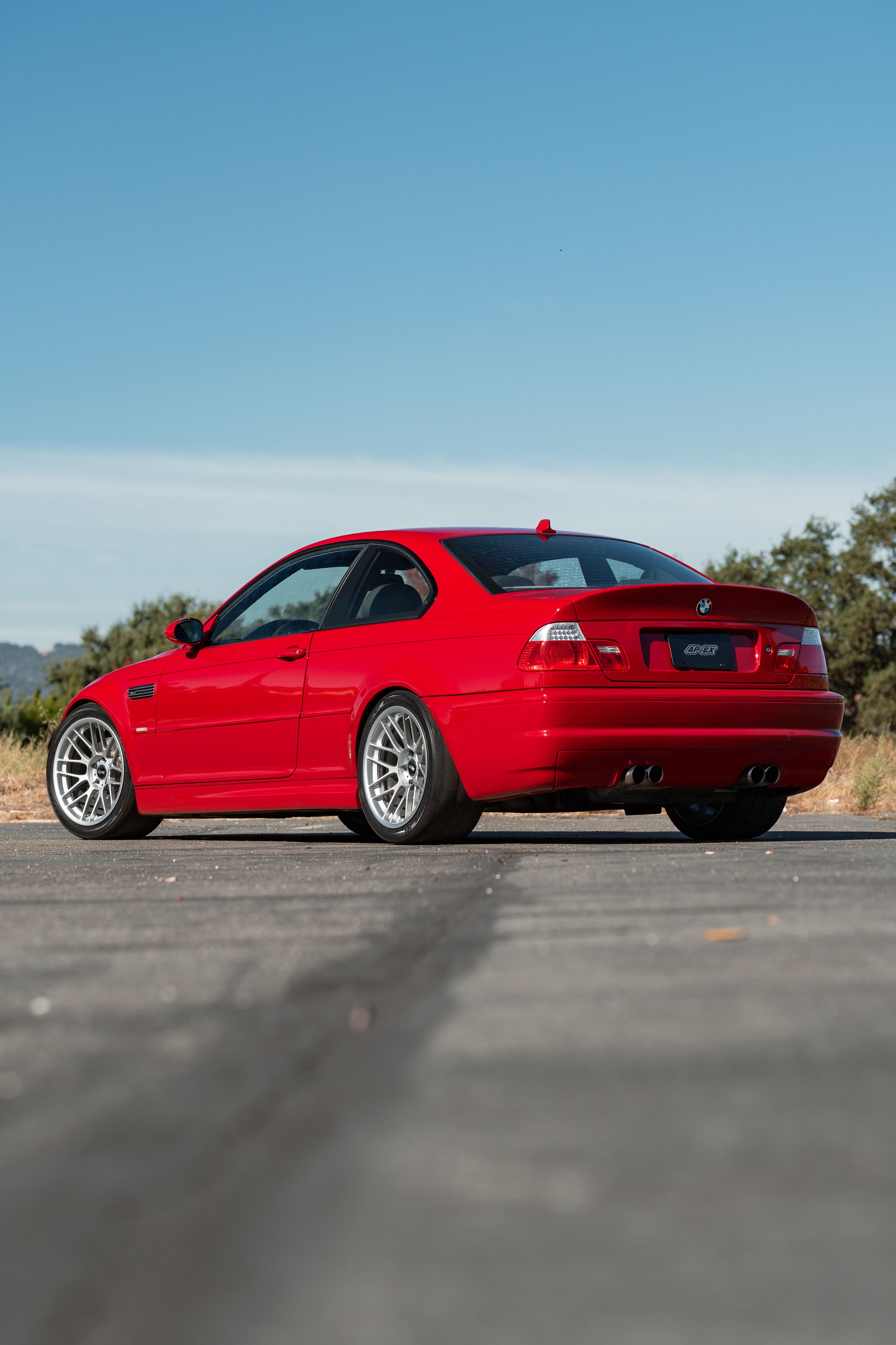 Red BMW E46 M3 with 18" ARC-8RT Apex wheels in Race Silver