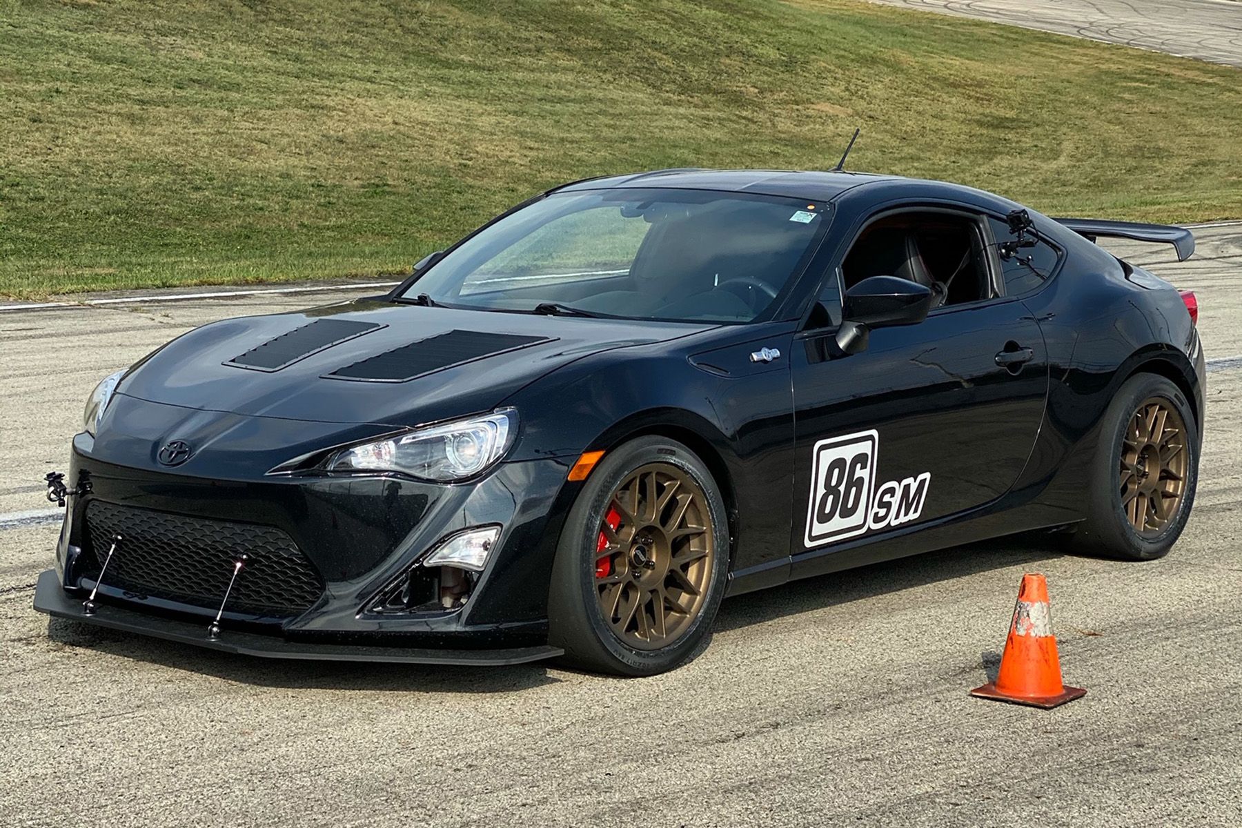 Black Scion FR-S with 17" ARC-8 Apex wheels in Satin Bronze