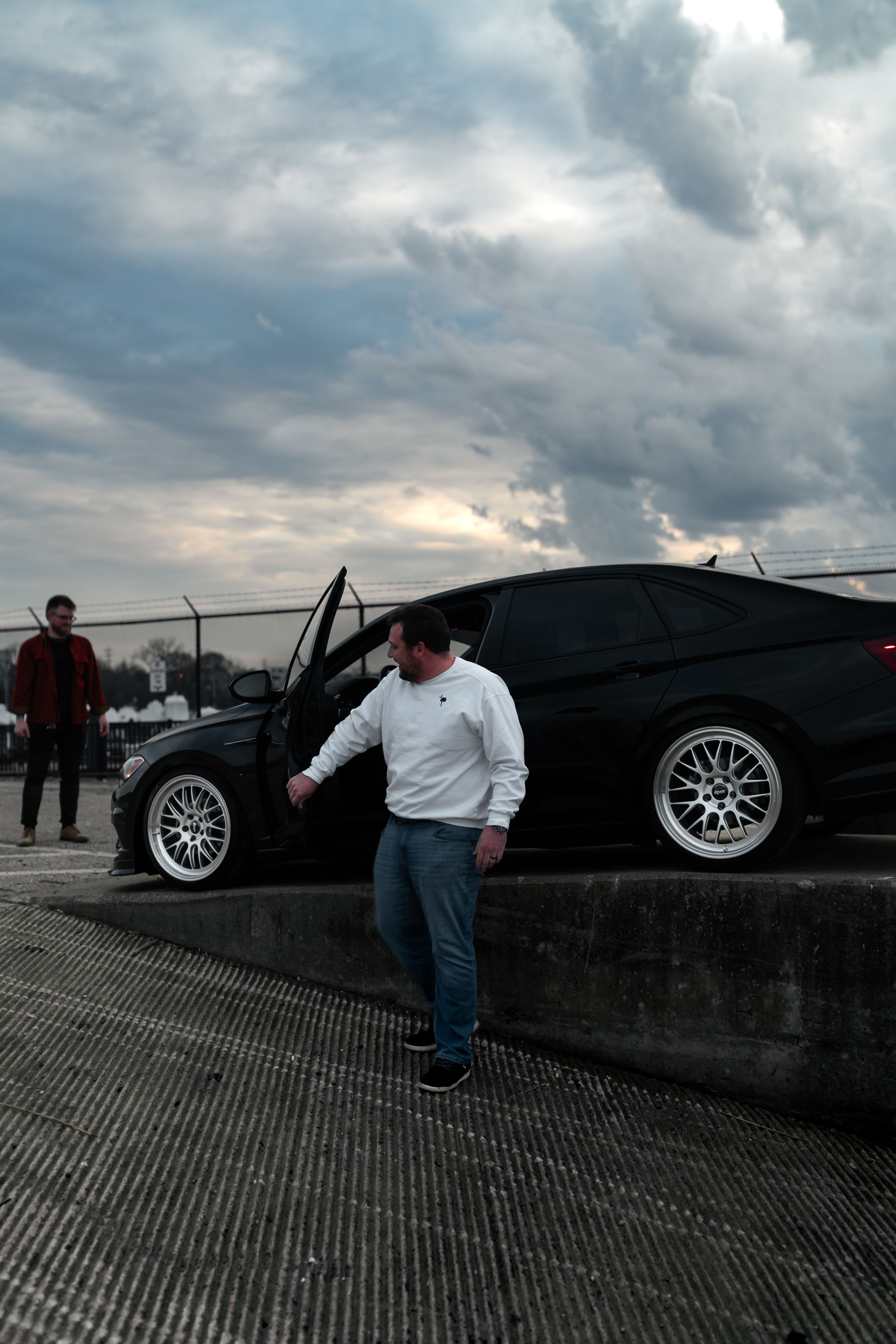 Black VW MK7 Jetta with 19" ML-10RT Apex wheels in Machined Lip Race Silver